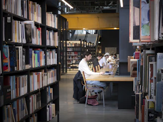 People studying at tables in a modern library