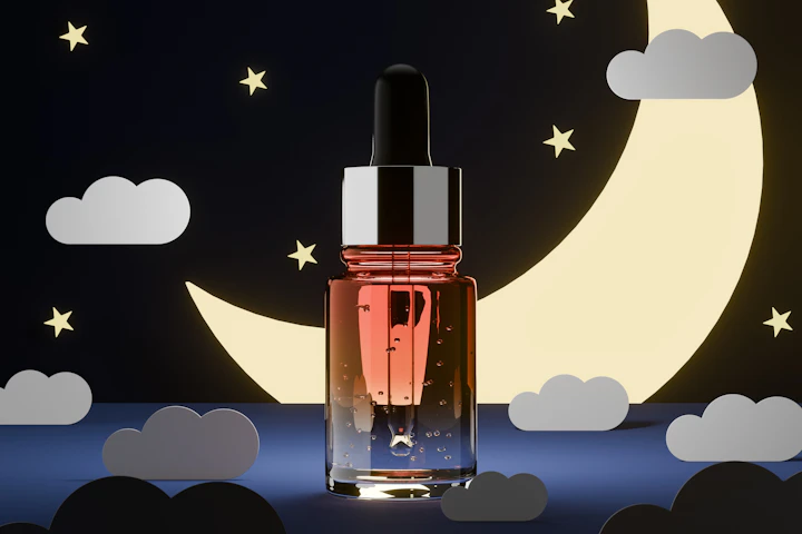 Dropper bottle of serum photographed against a deep night-sky backdrop