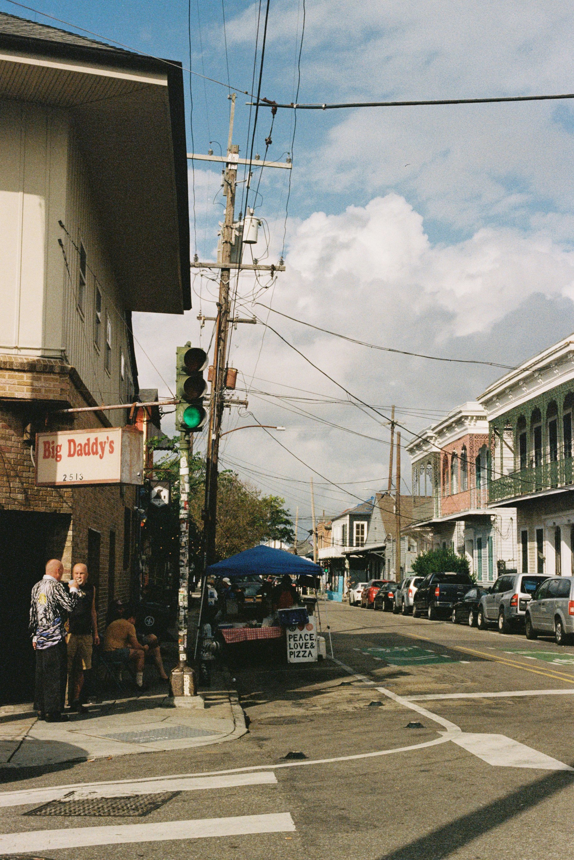 Street scene with buildings and people on a sunny day