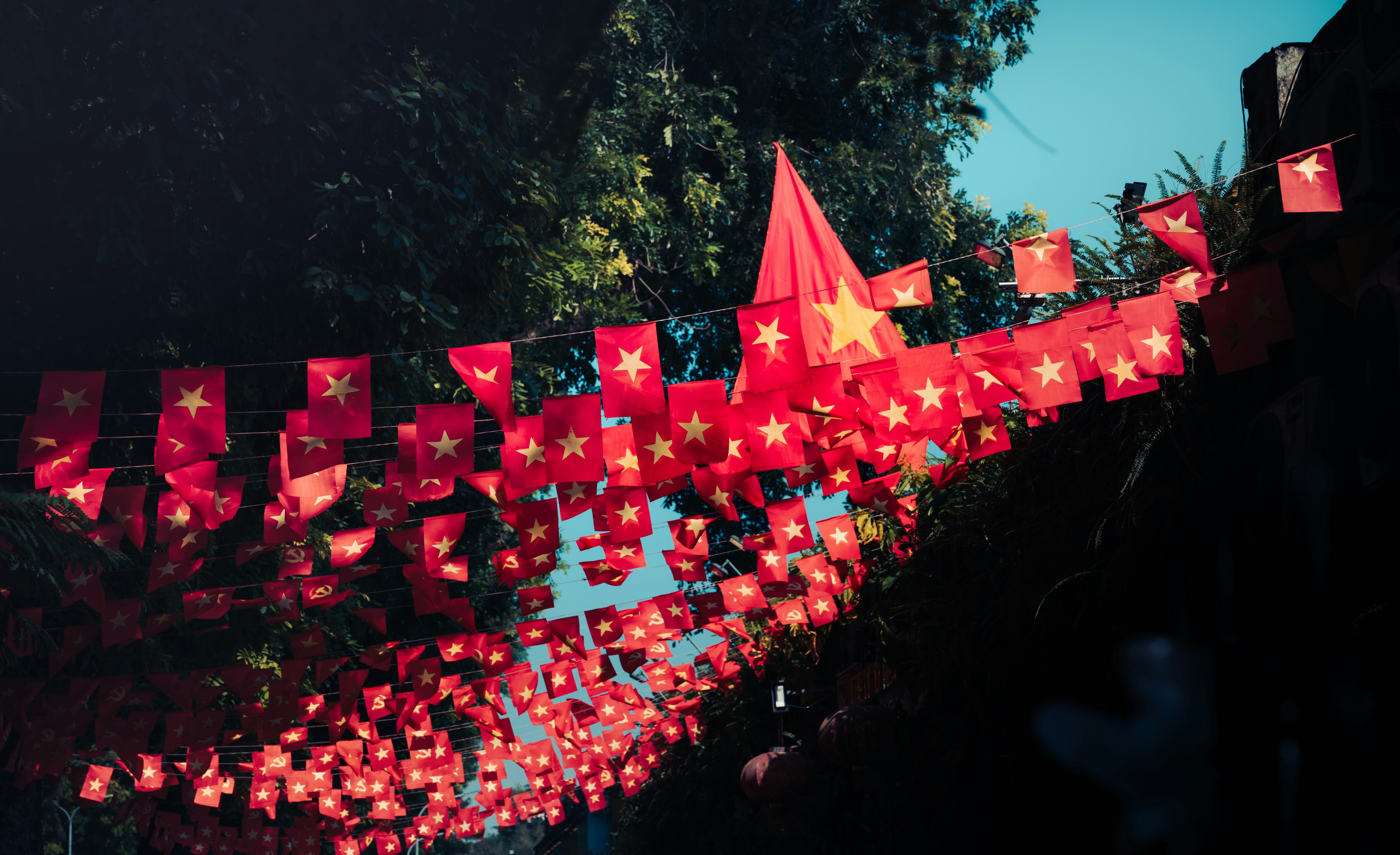 Red vietnamese flags strung across a street