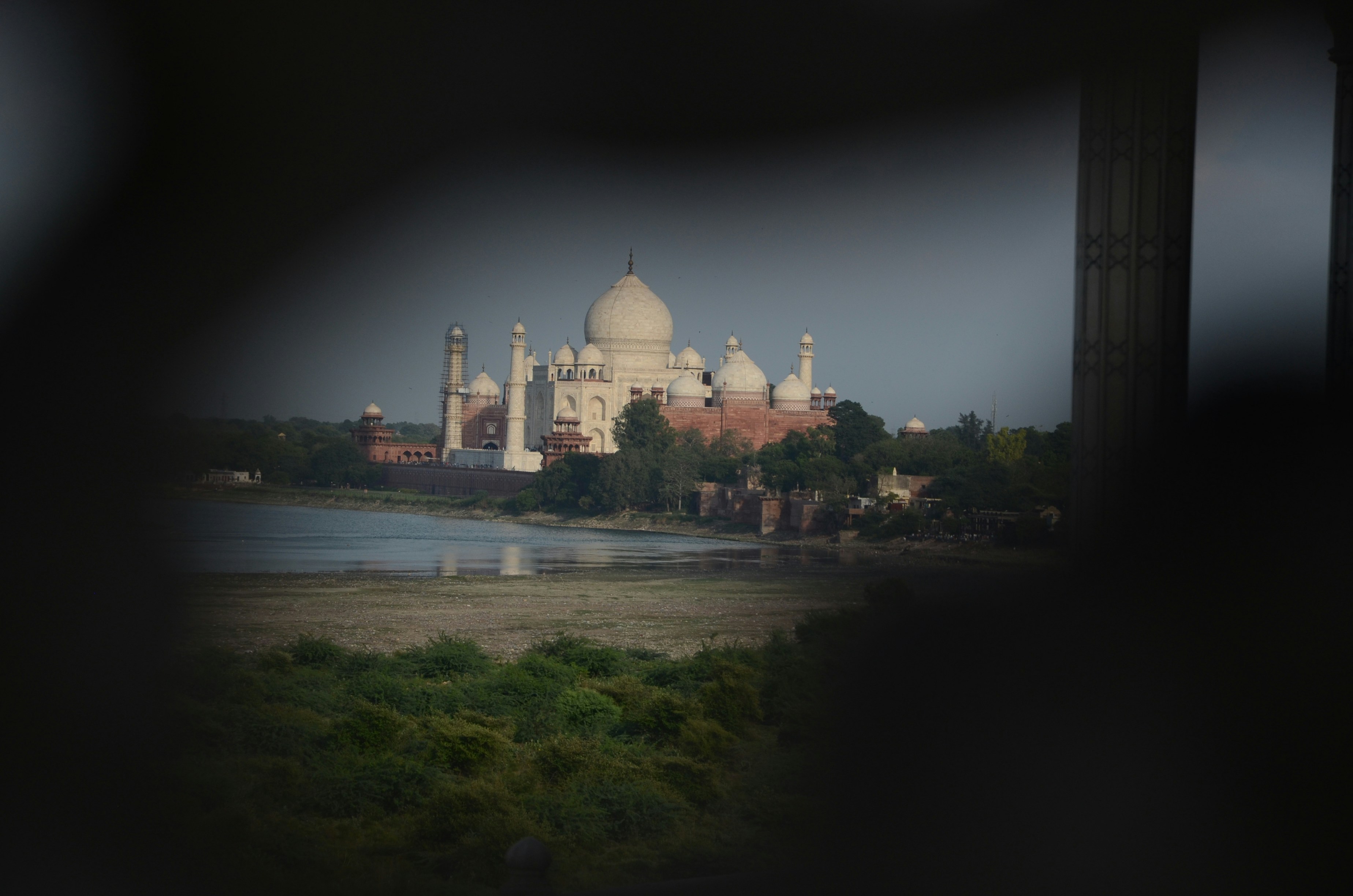 The taj mahal viewed through a frame.