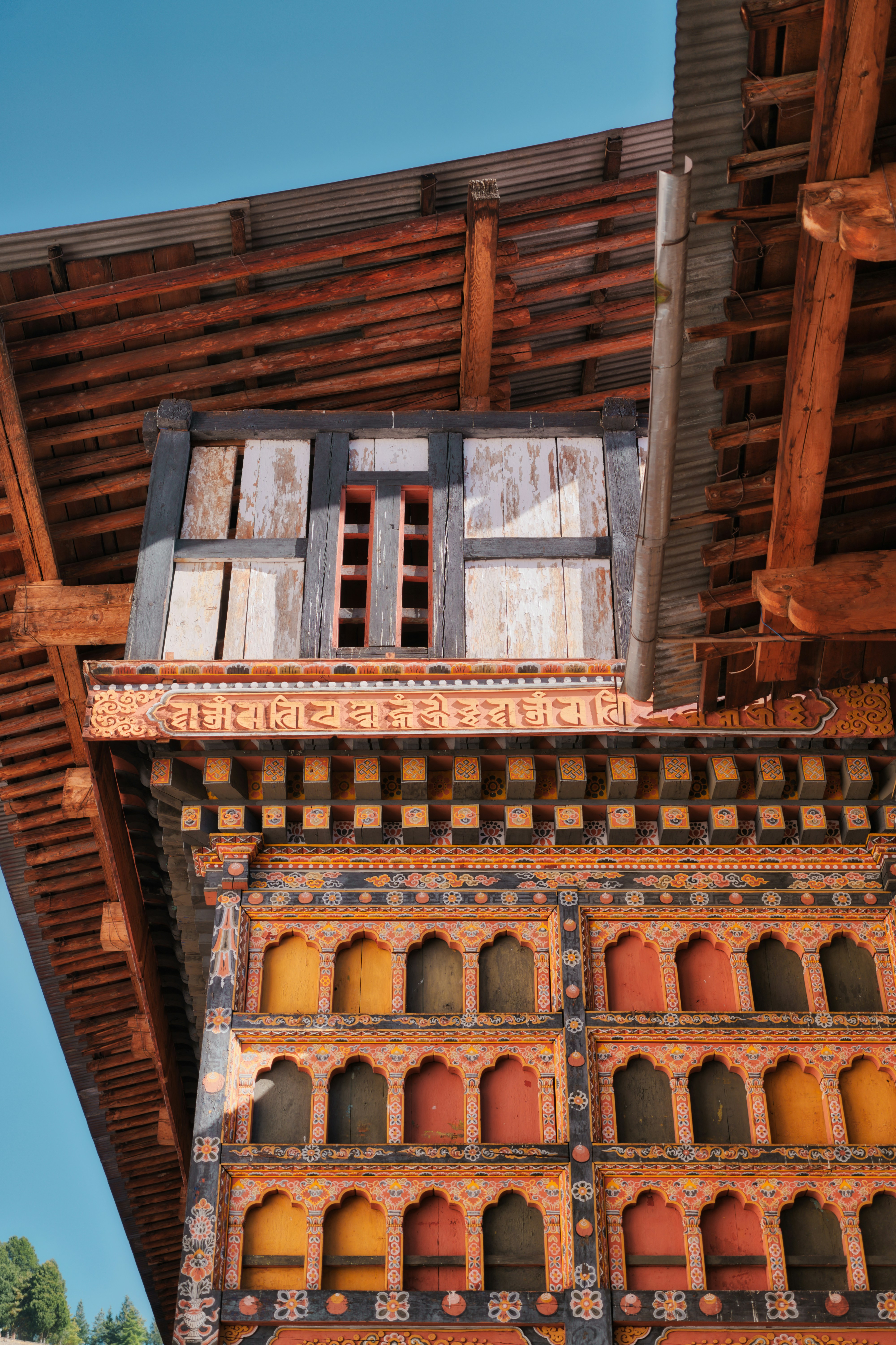 Intricately decorated building facade with colorful windows.