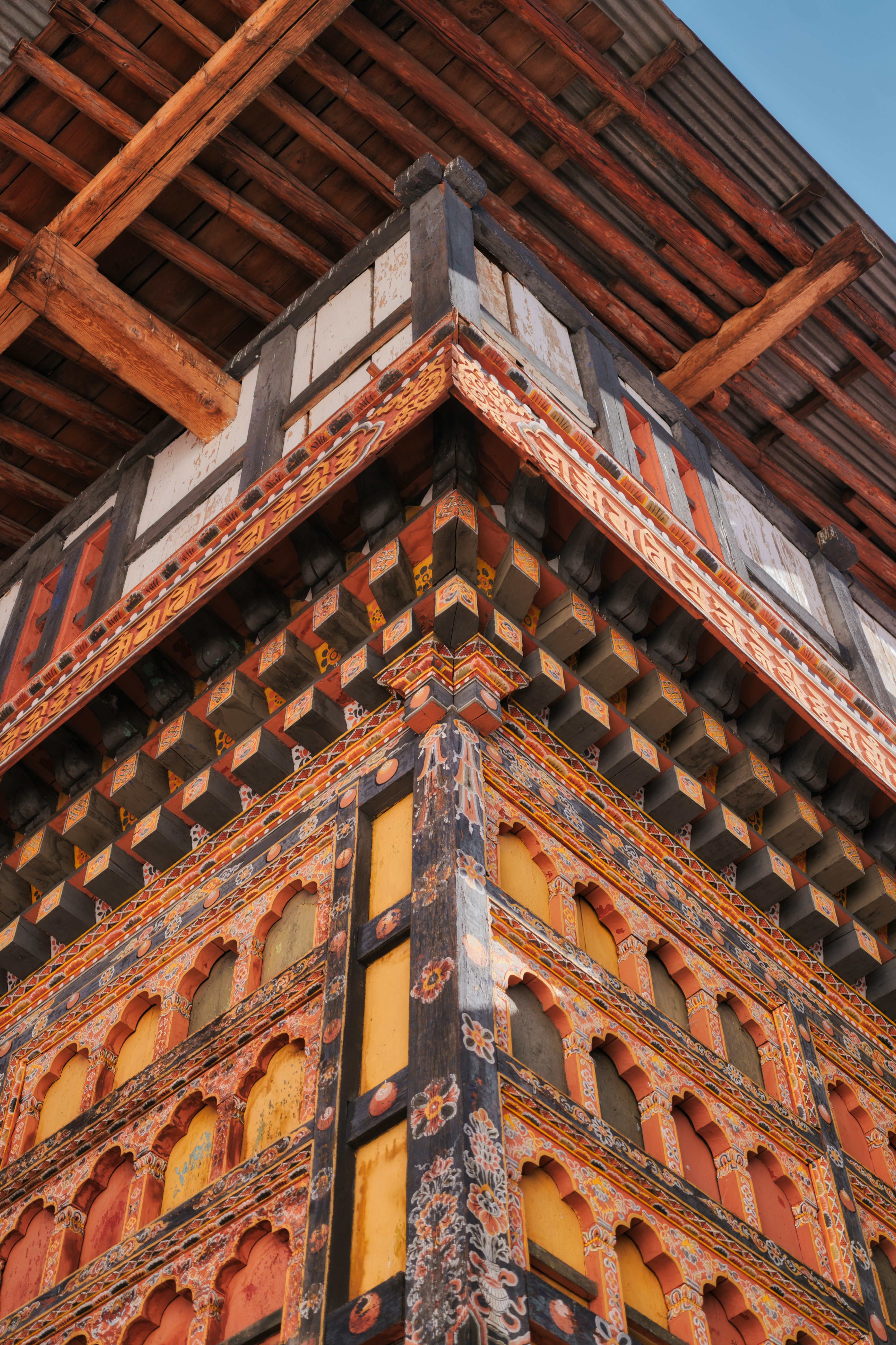 Intricate architectural details of a traditional bhutanese building.