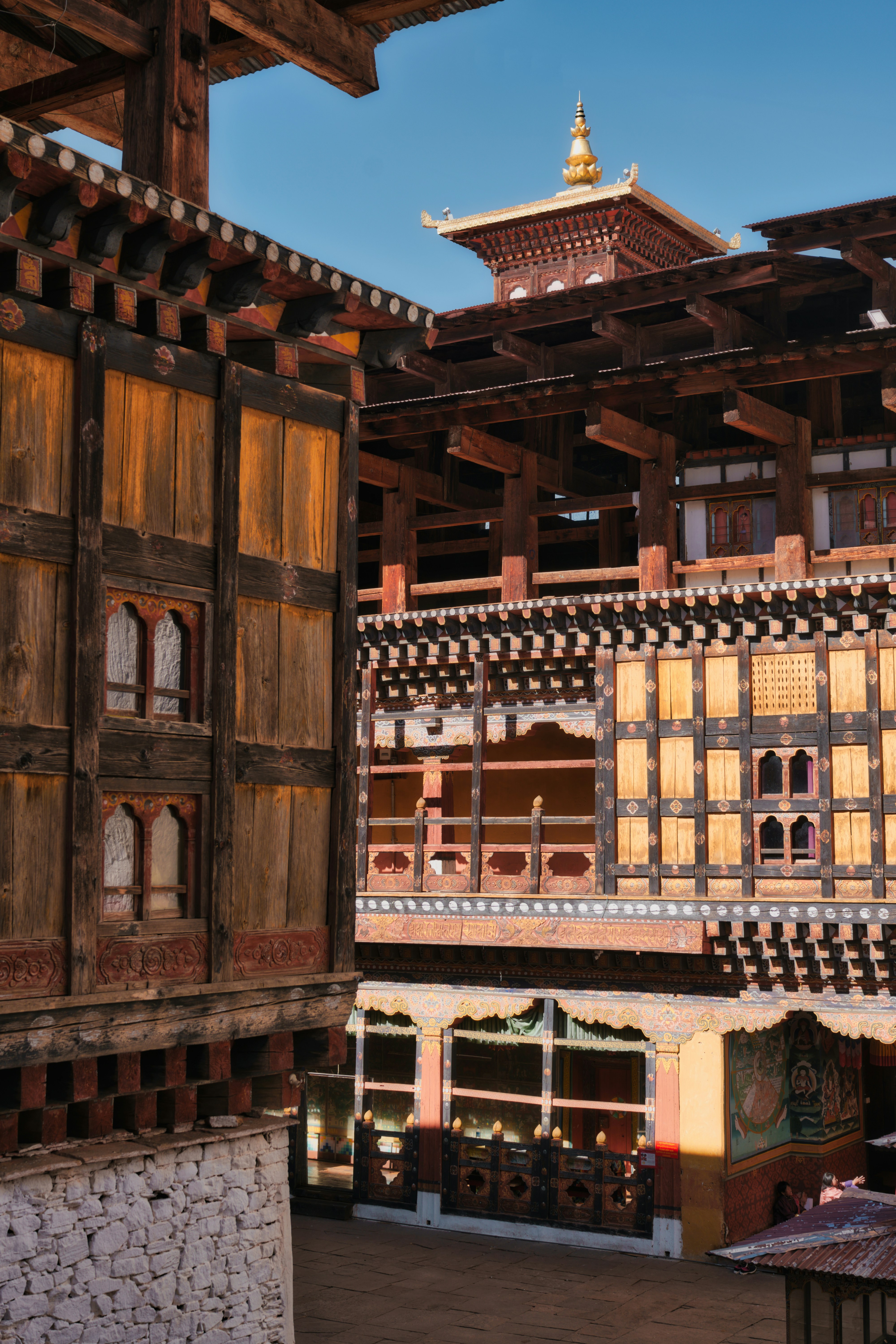 Traditional bhutanese architecture with intricate wooden details.