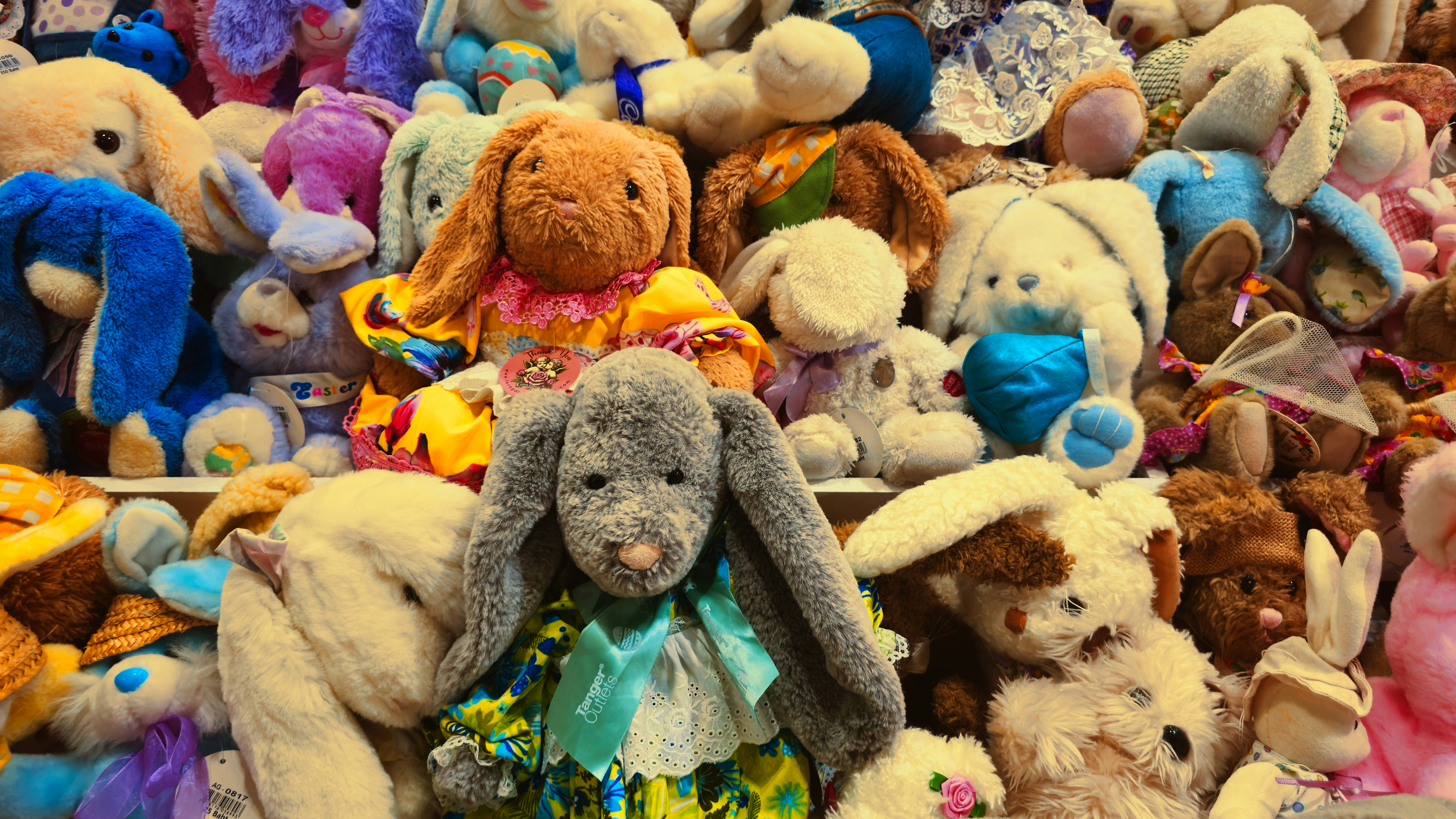 A large collection of stuffed bunny rabbits
