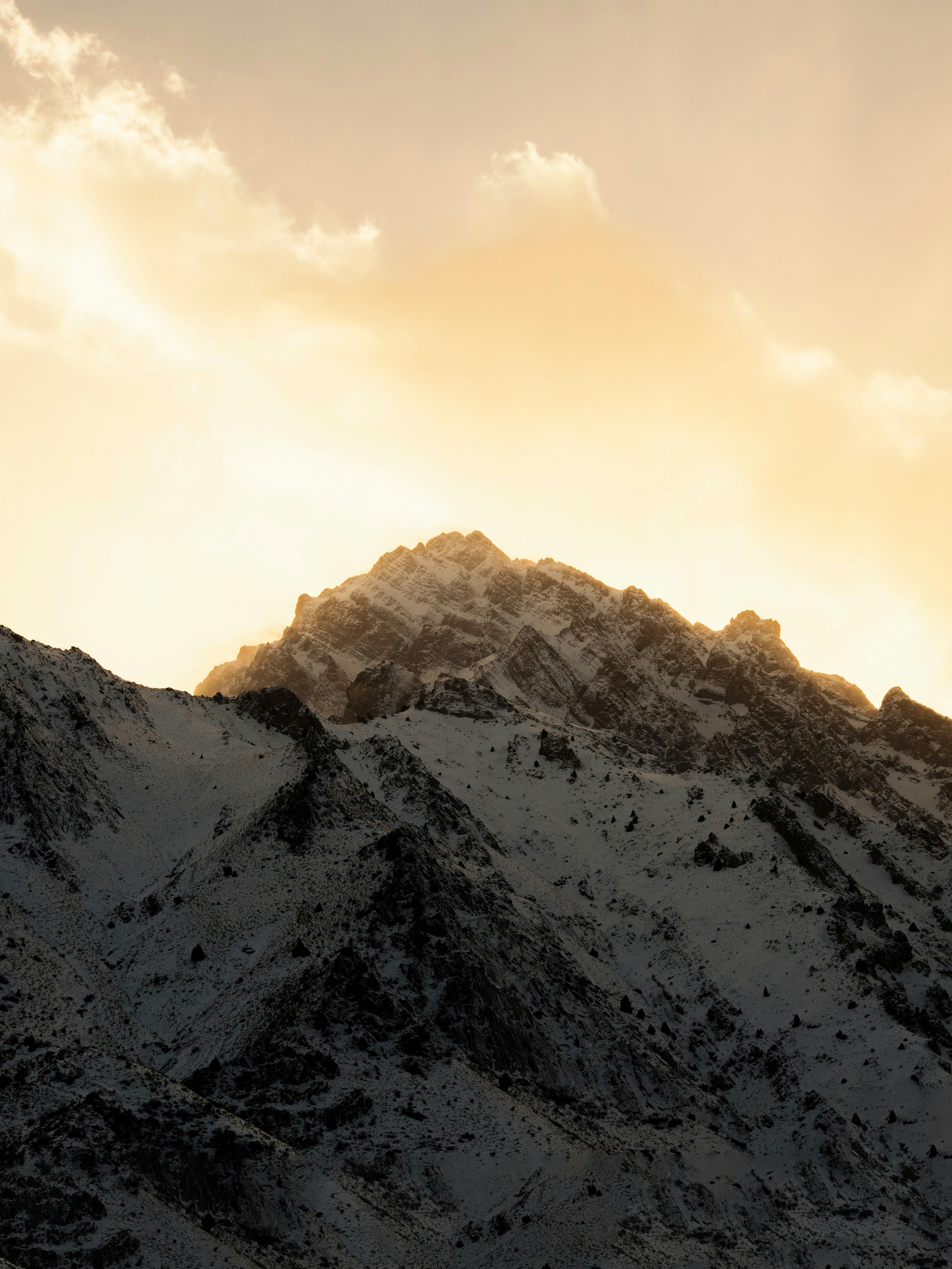 Snow-covered mountain peak at sunrise