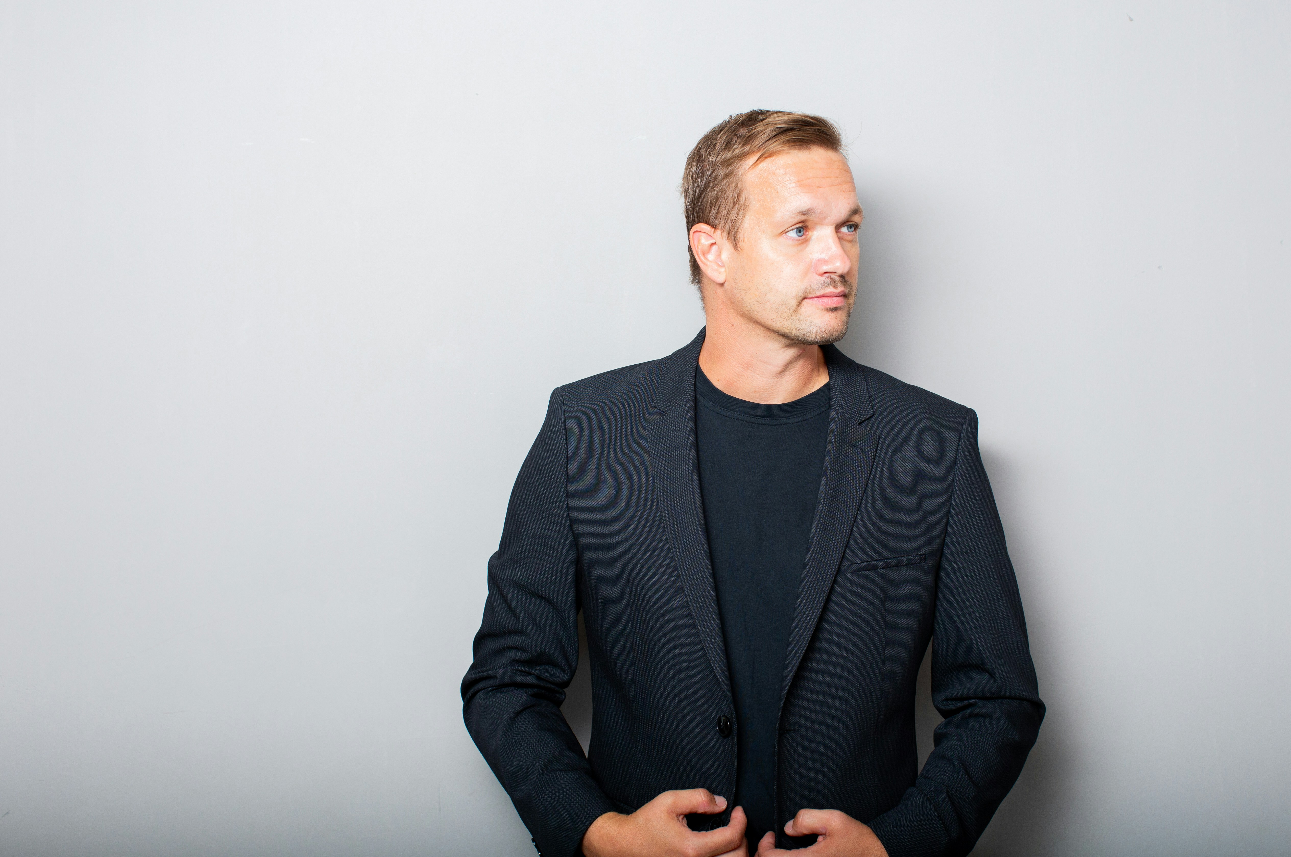 Man in a dark suit jacket and shirt