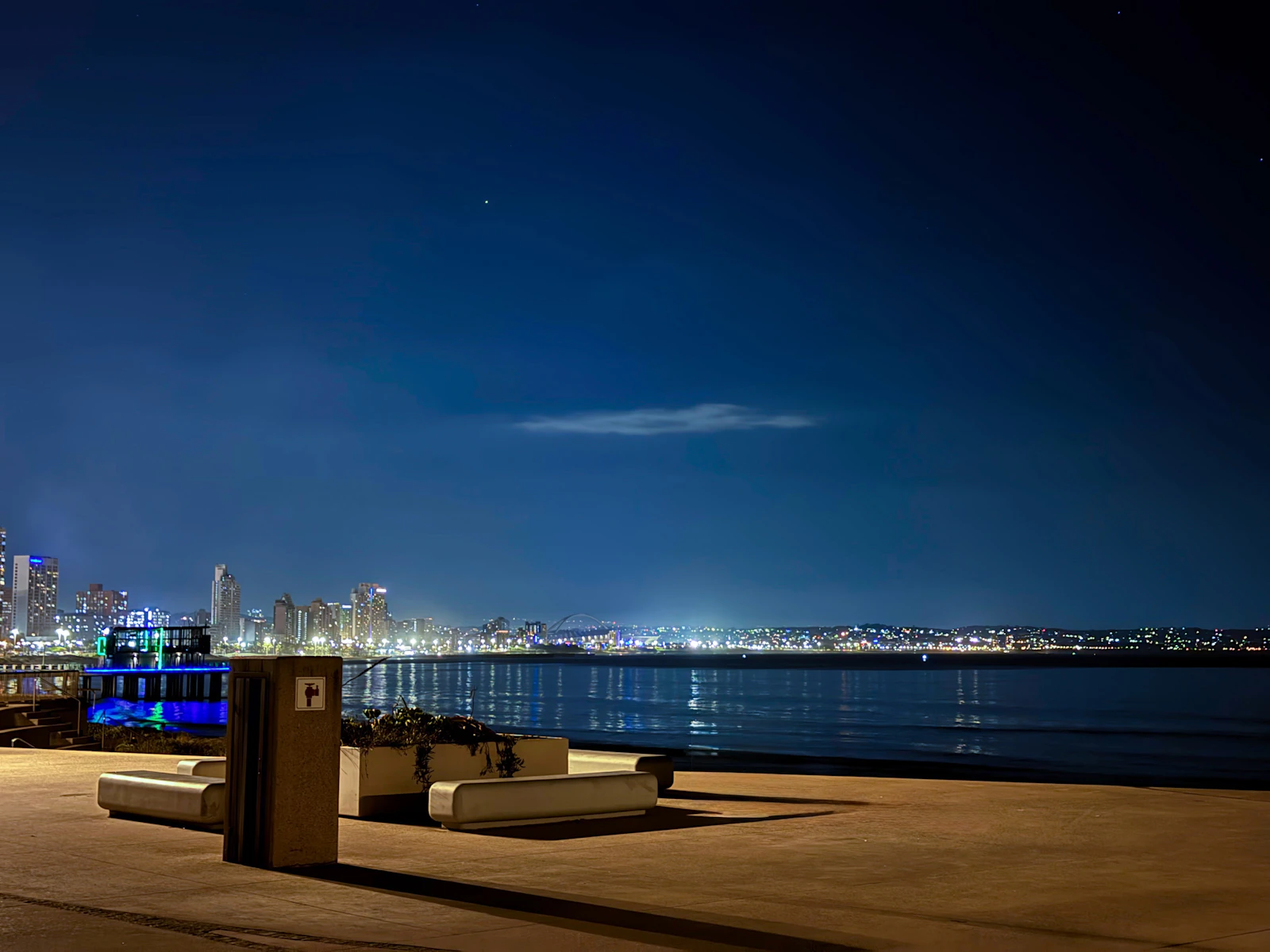 City skyline illuminated at night acro