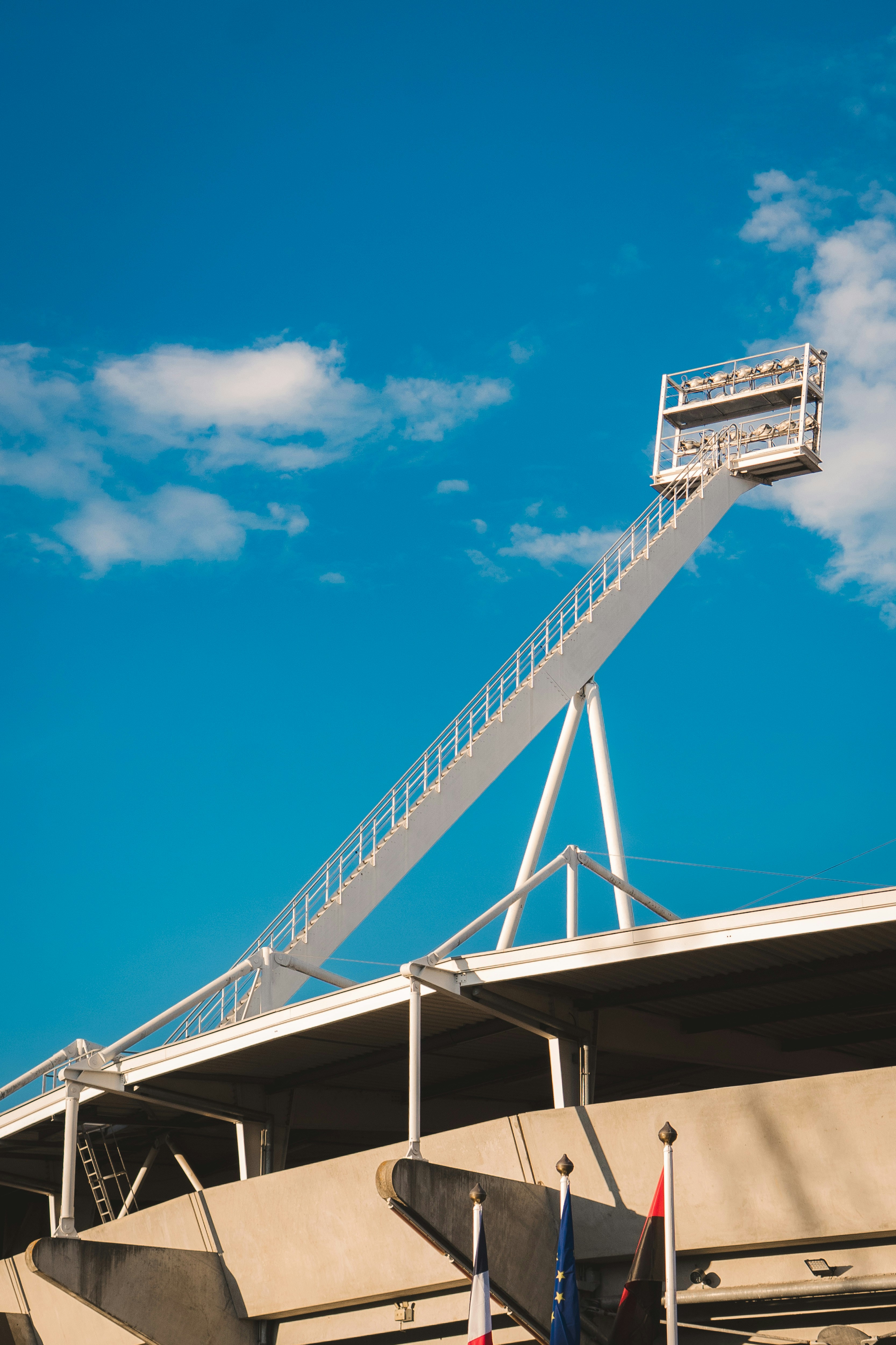 Stadium floodlight against a clear blue sky