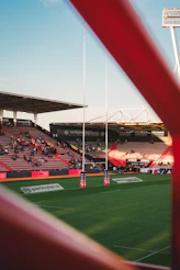 Rugby stadium with goalposts and spectators in stands