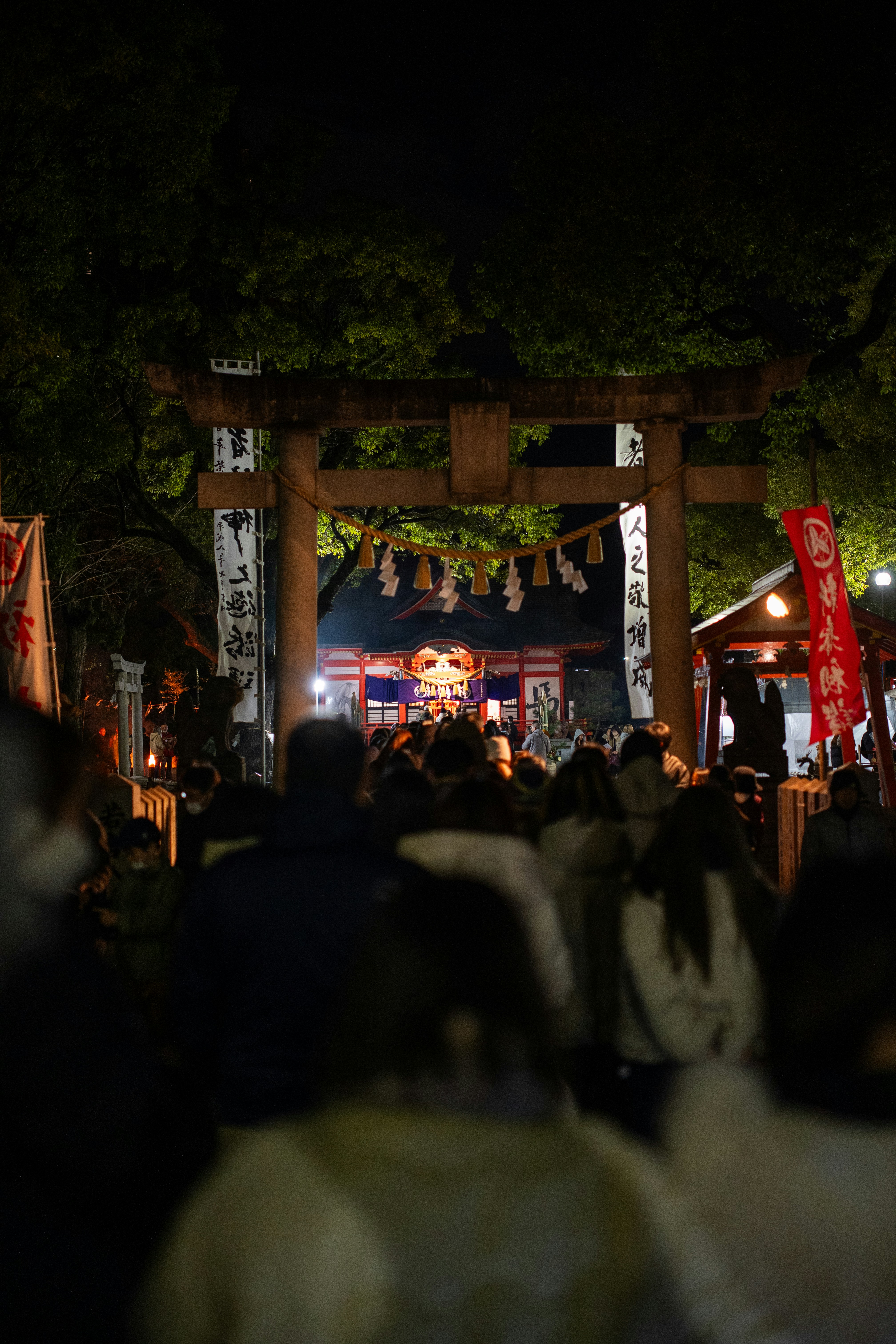 Crowd at a japanese shrine at night