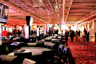 People walking through a busy casino gaming floor
