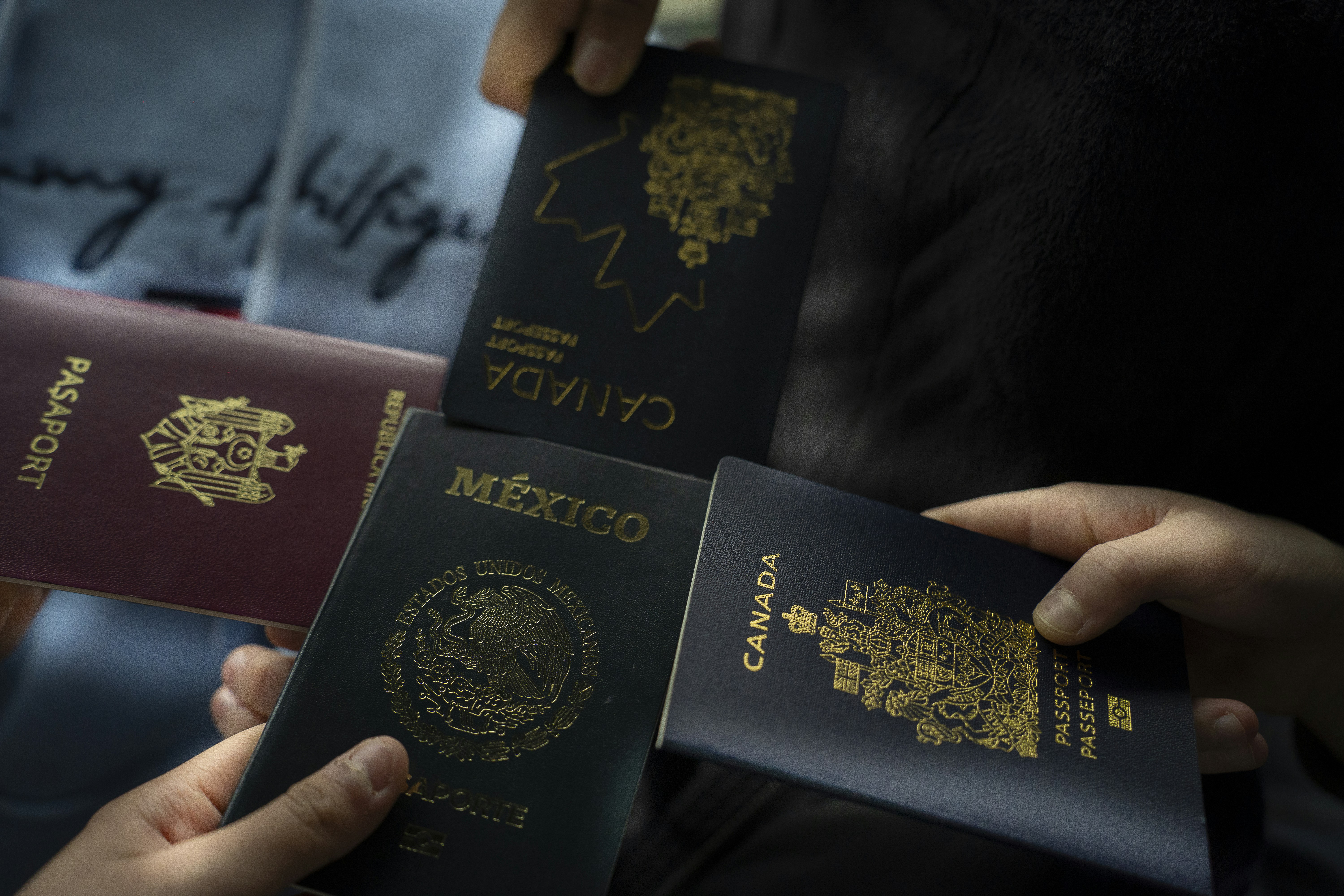 Four passports held by different people