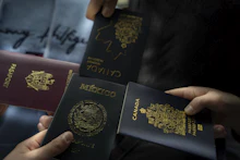 A passport with entry stamps on its pages