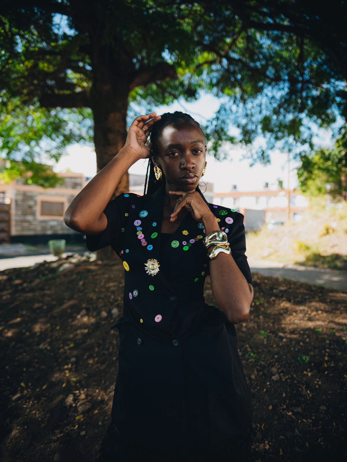 Young Black woman with braided hair and embellishments