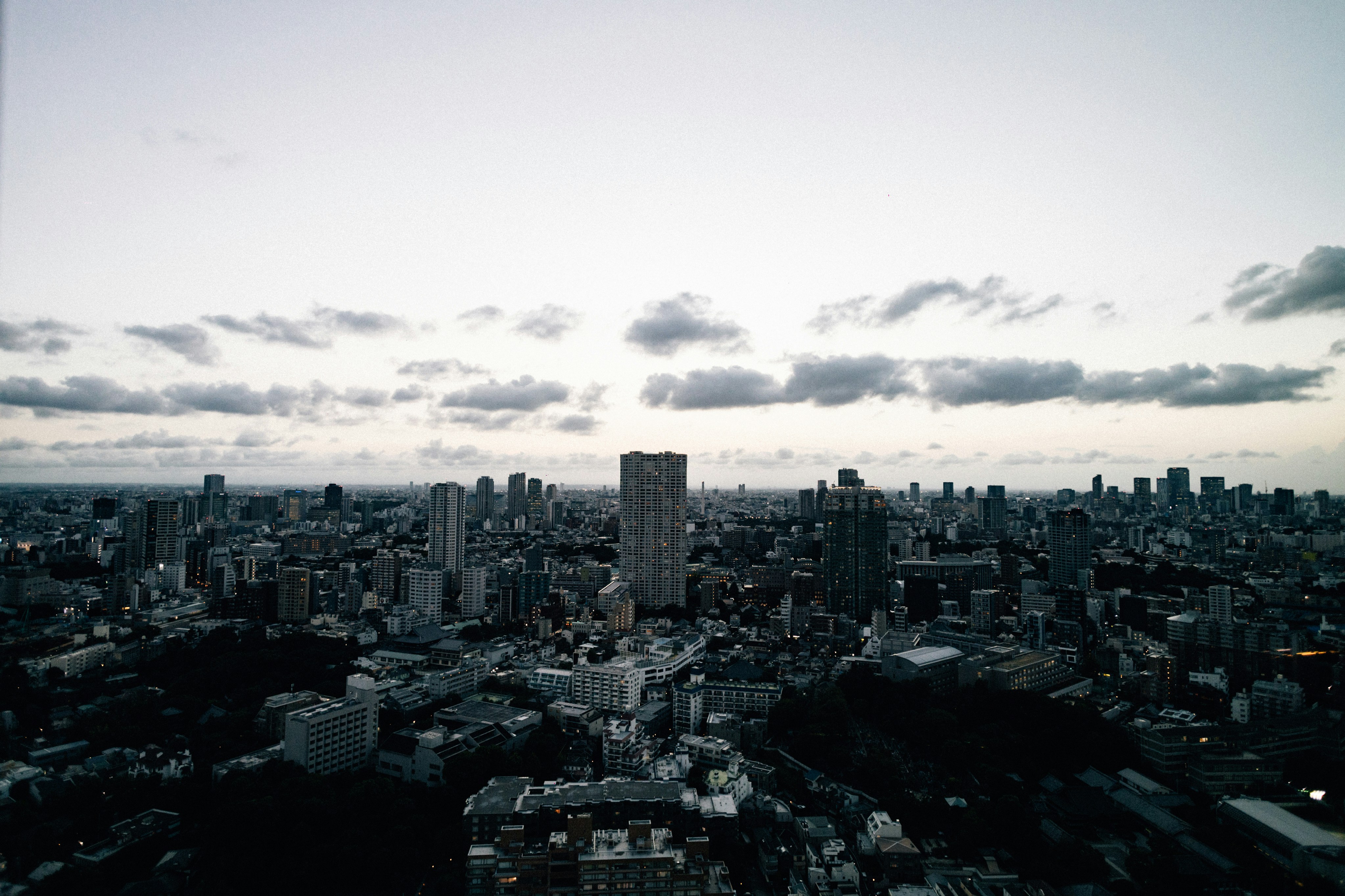 Panoramic view of a sprawling cityscape at dusk