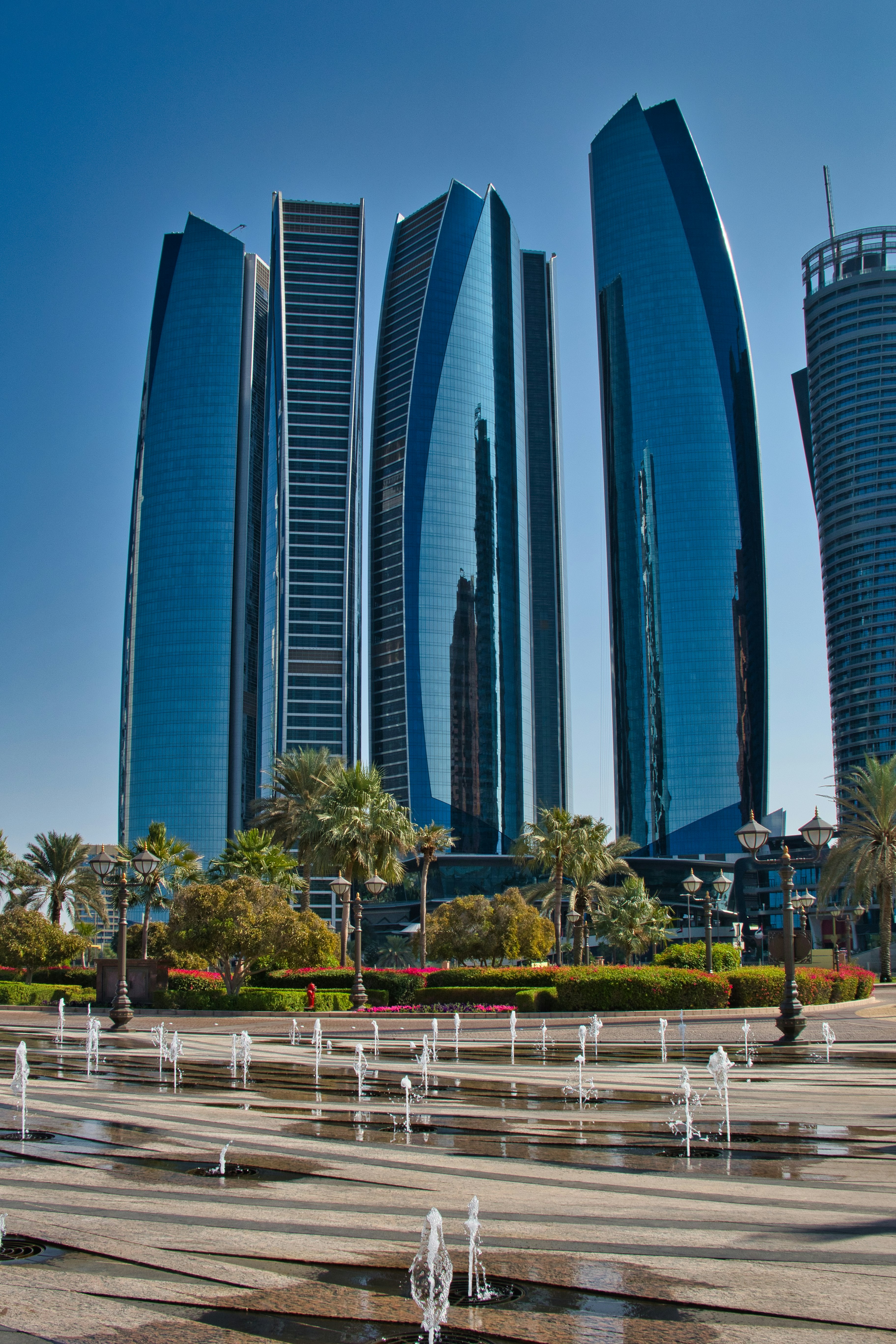Modern skyscrapers with fountains in foreground