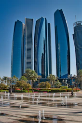 Modern skyscrapers with fountains in foreground