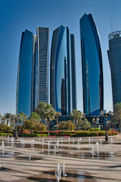 Modern skyscrapers with fountains in foreground