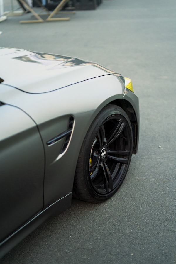 Sleek dark gray alloy car wheel close-up