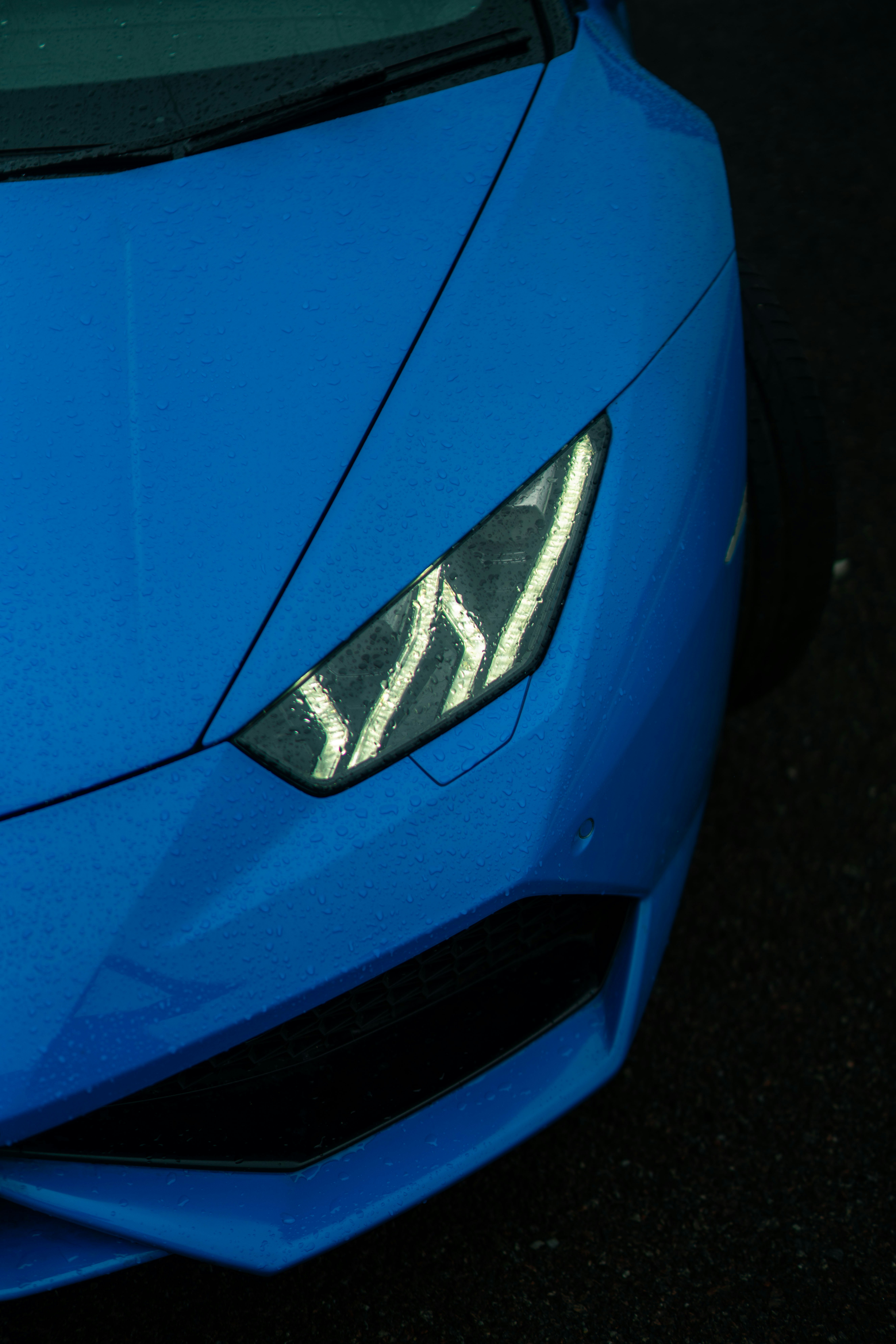 Close-up of a blue sports car headlight