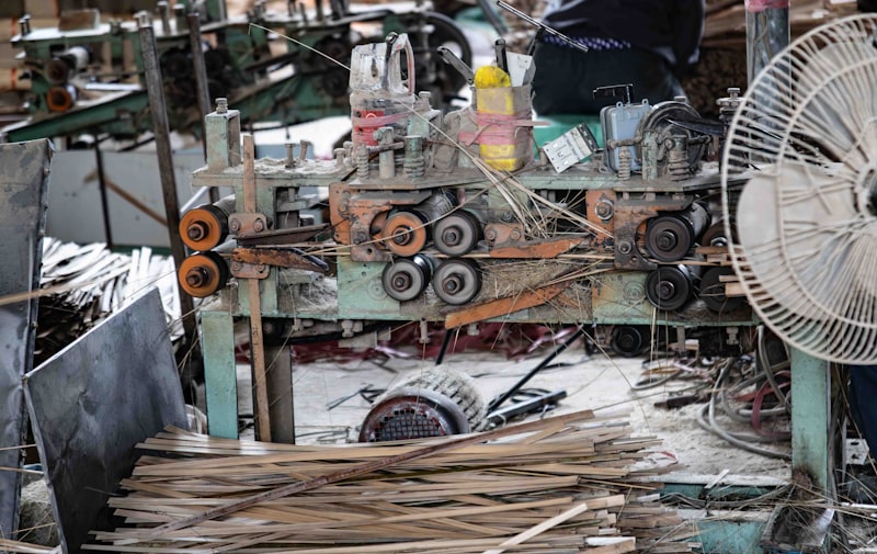 Wood processing machinery with stacked lumber in a factory