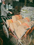 Bundles of incense sticks on a cart