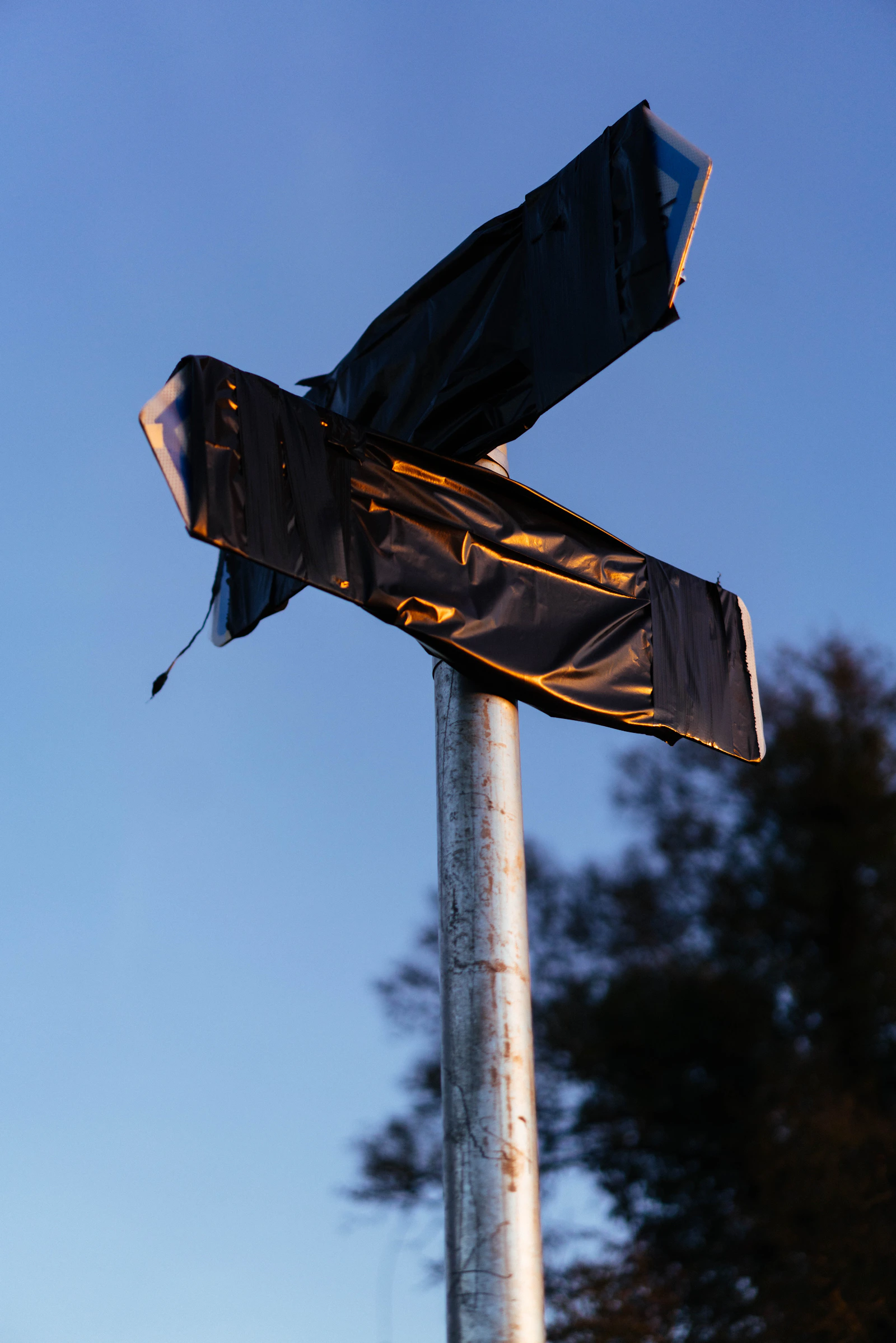Two directional signs at a fork — pick the right path. Photo by Phil Hearing via Unsplash.