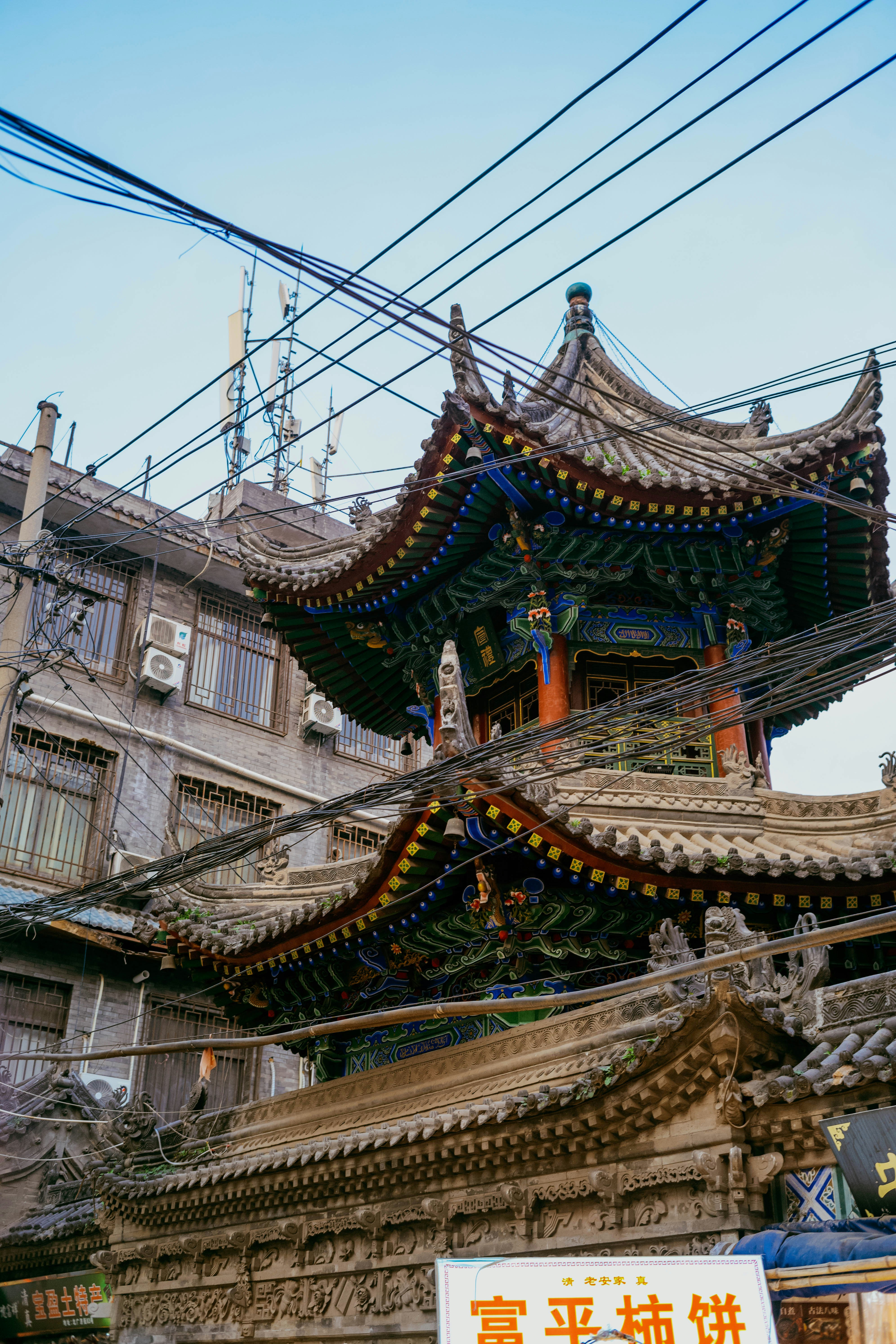 Ornate traditional building with tangled power lines