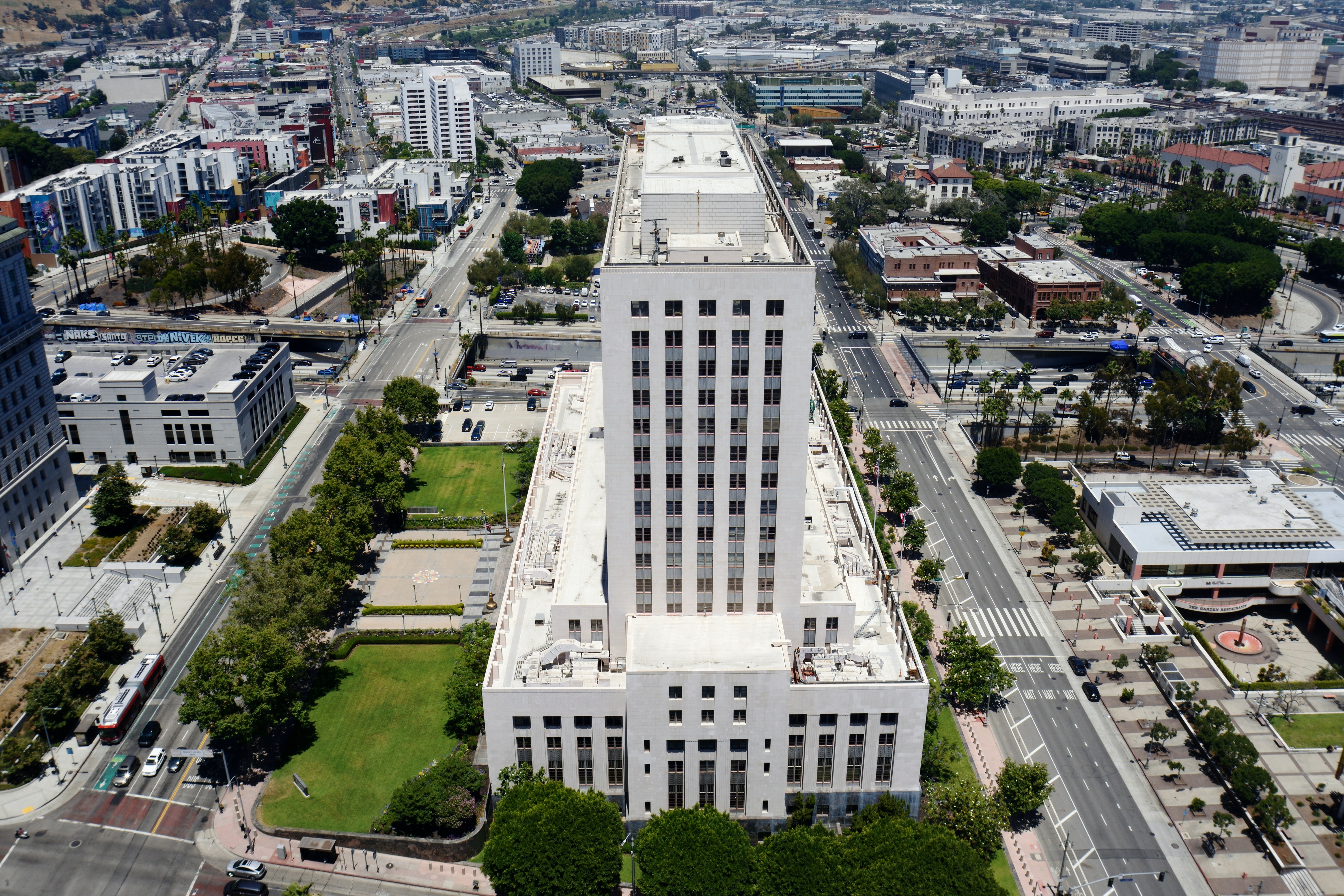 Aerial view of a large white building in a city