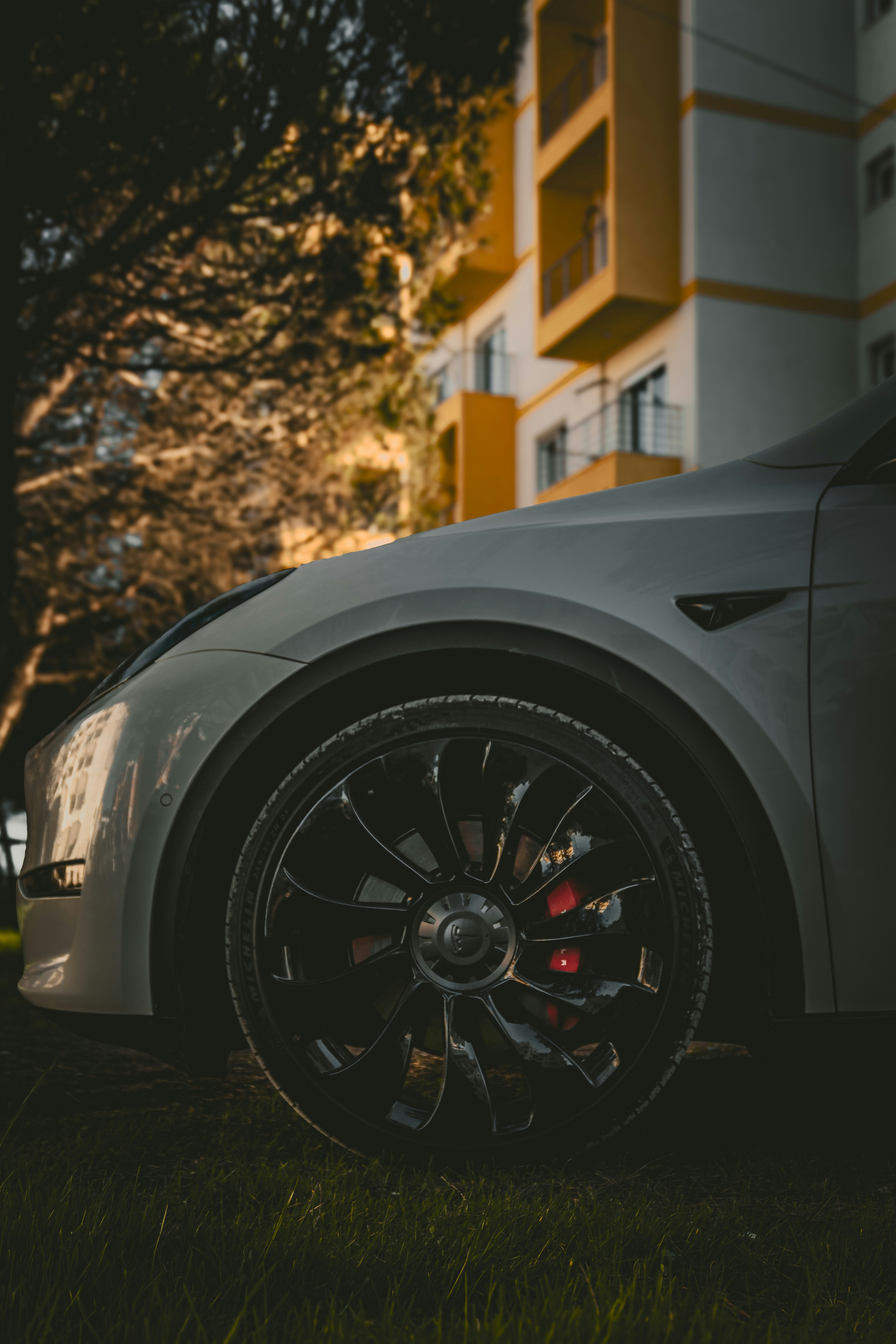 Close-up of a modern white car wheel and its wheel.