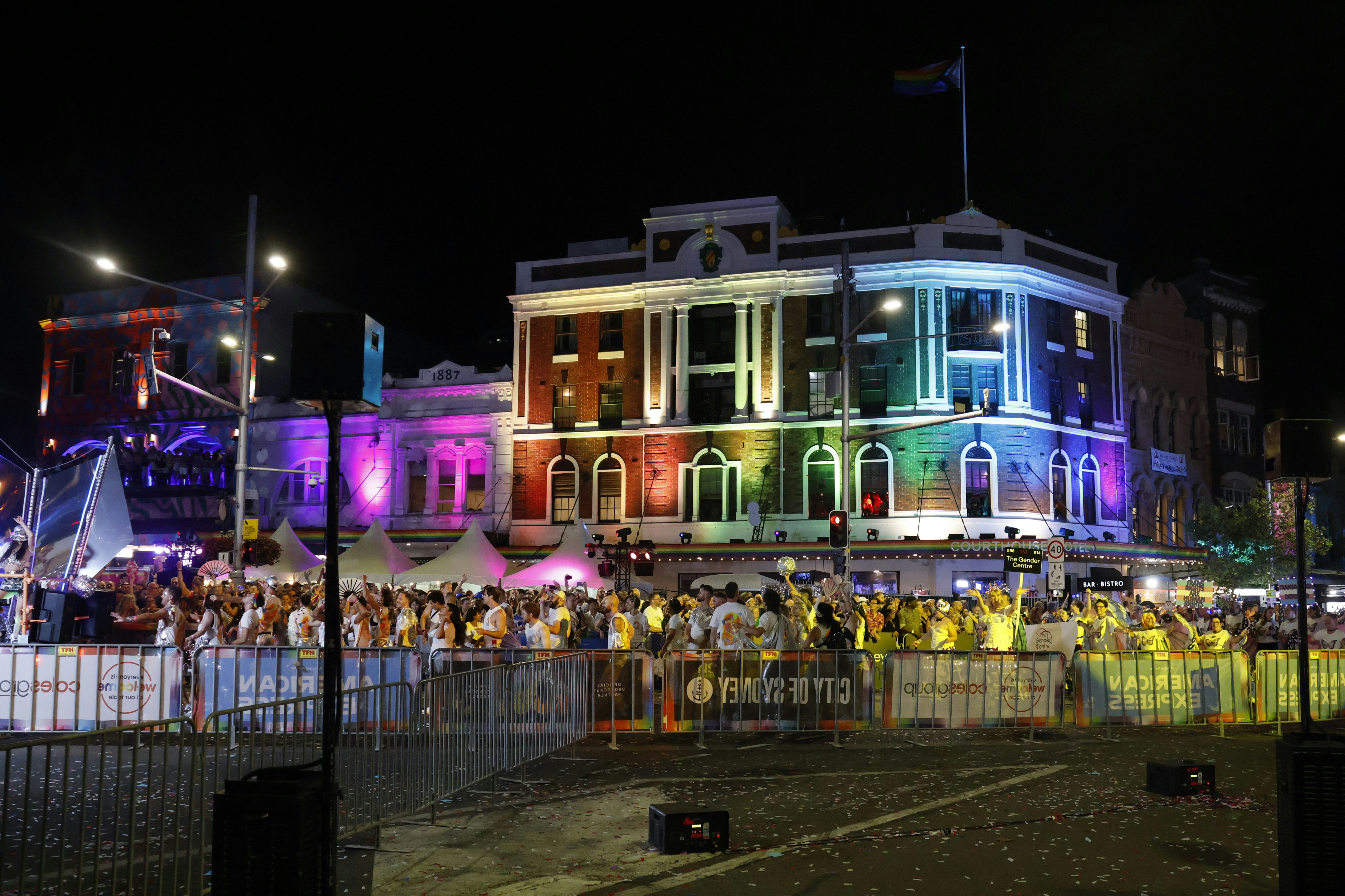 Building illuminated with rainbow colors at night event