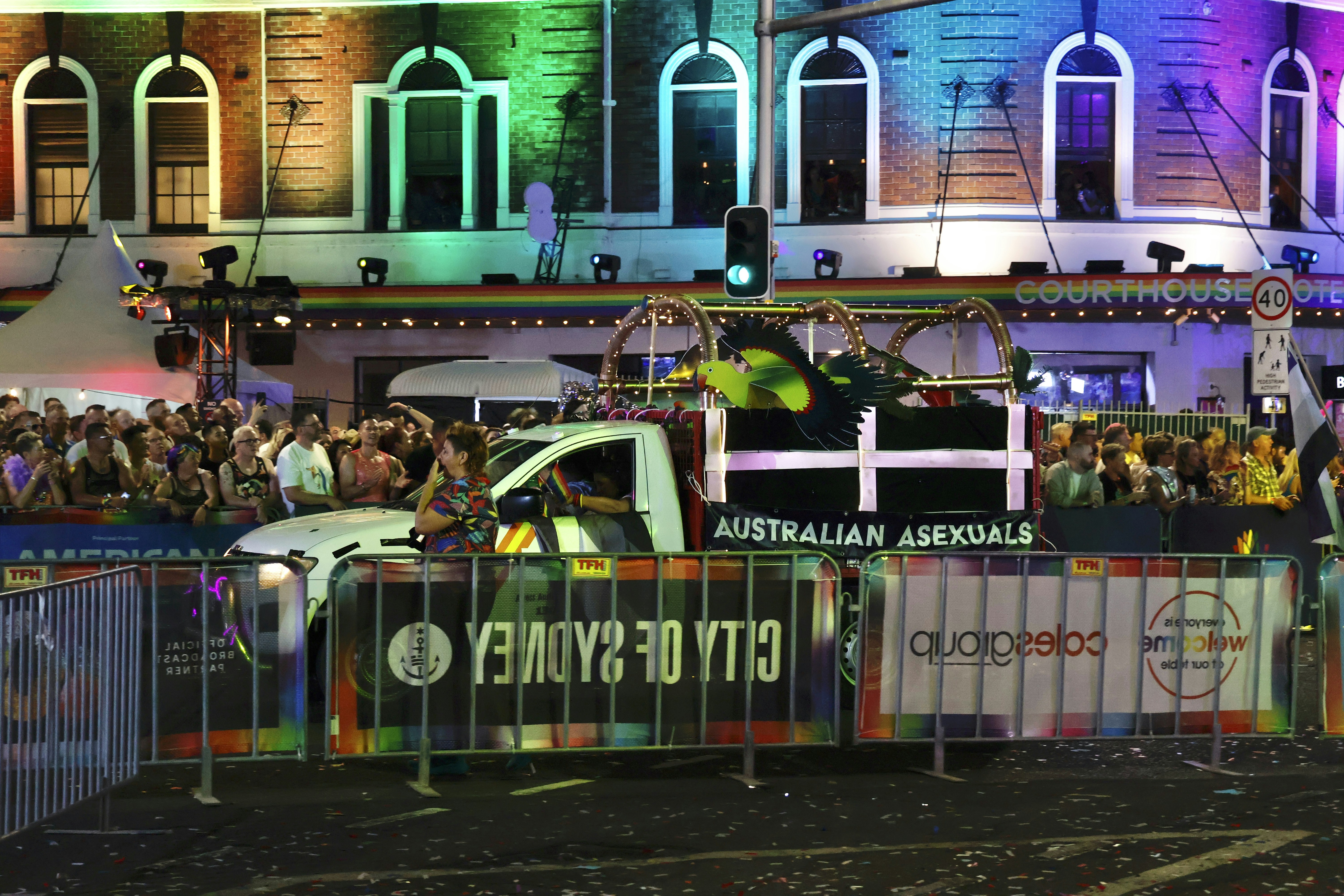 Parade float with "australian asexuals" sign.