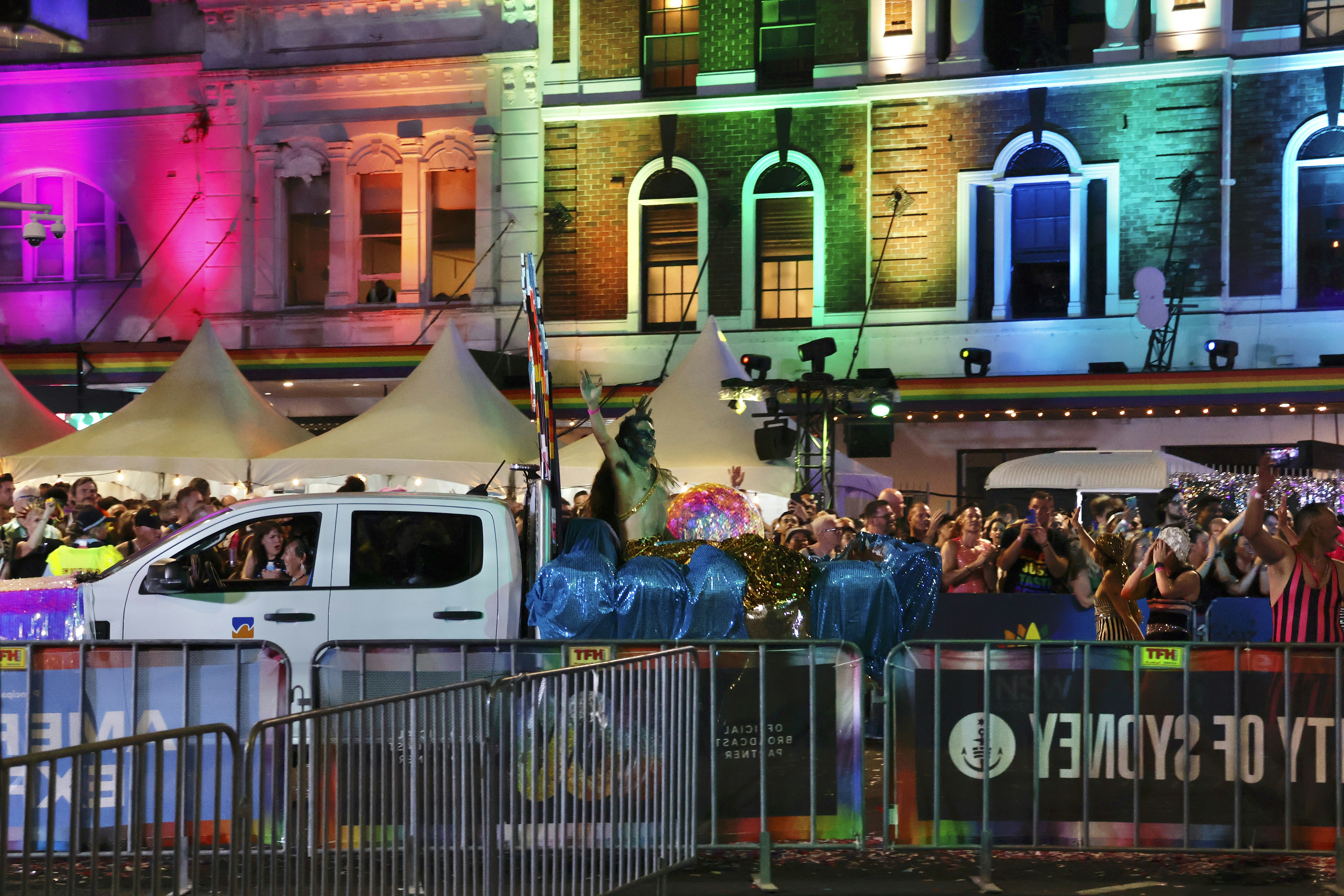 A crowd celebrating at a night event