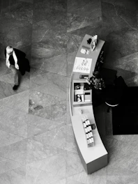 Man walks past a curved display counter