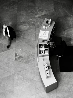 Man walks past a curved display counter