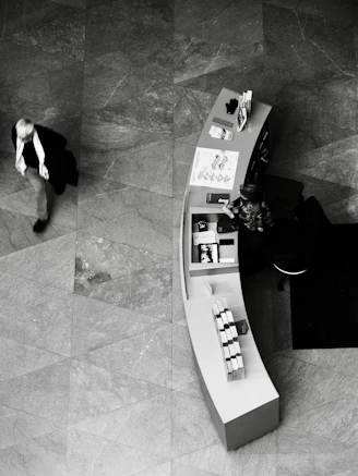 Man walks past a curved display counter