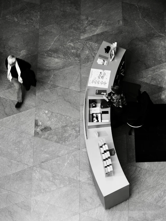 Man walks past a curved display counter