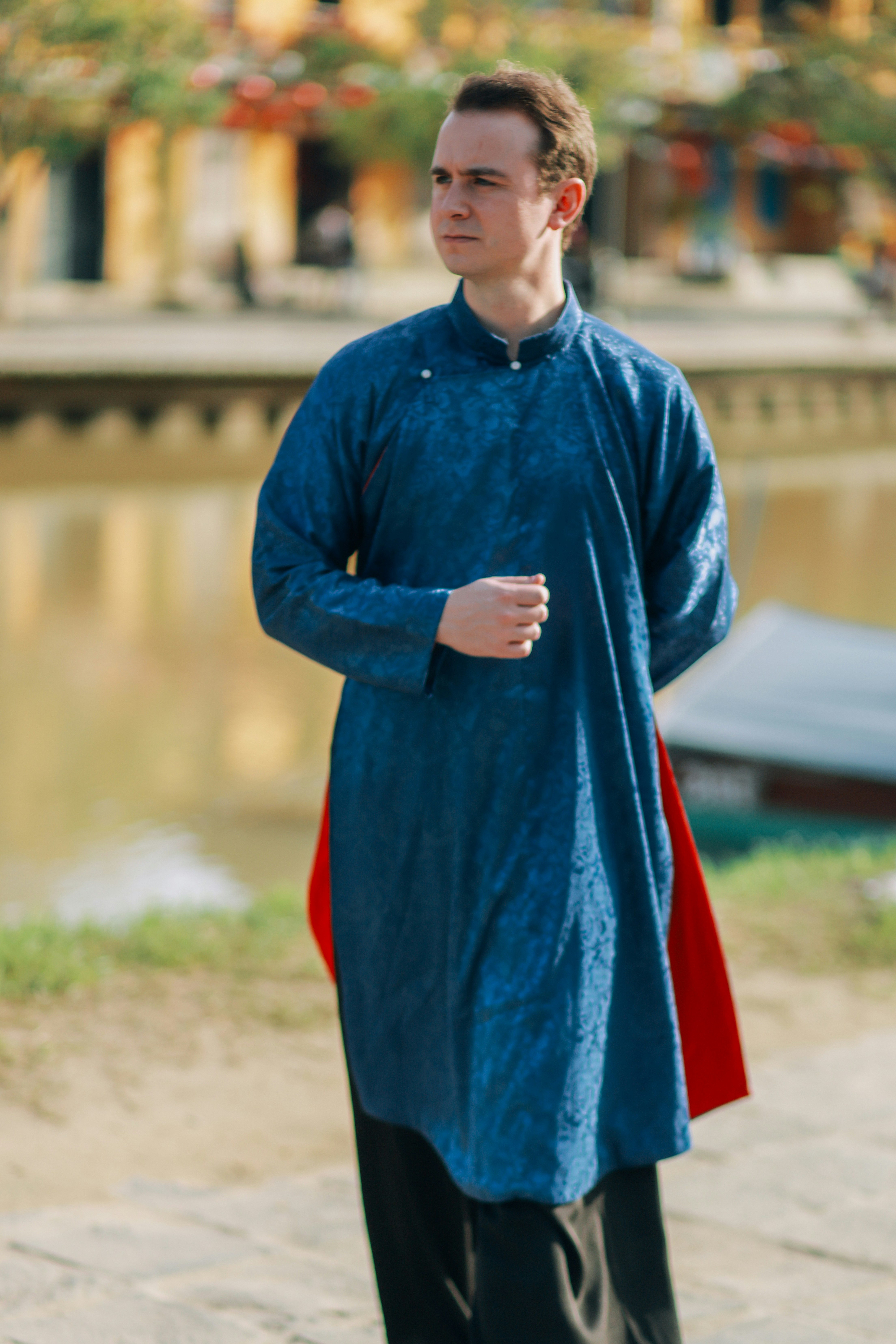 Man in traditional blue vietnamese ao dai