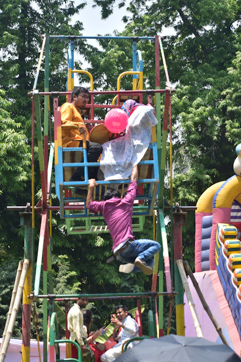 People enjoying a colorful ferris wheel ride outdoors