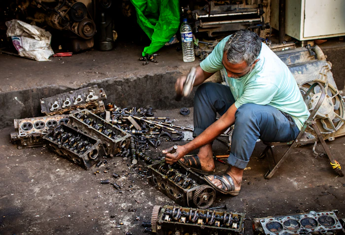 Mechanic working on engine parts