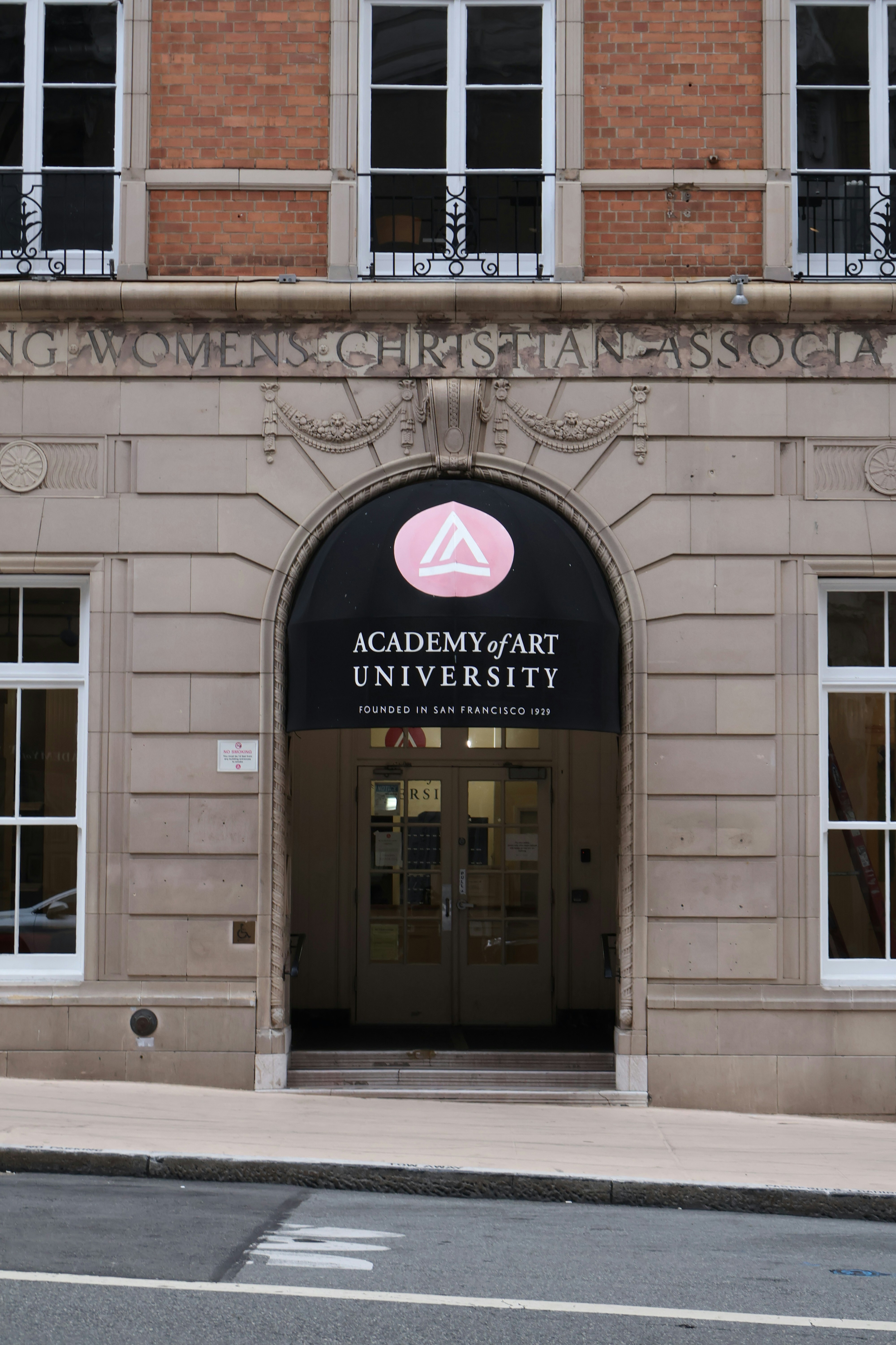 Academy of art university entrance with arched doorway.
