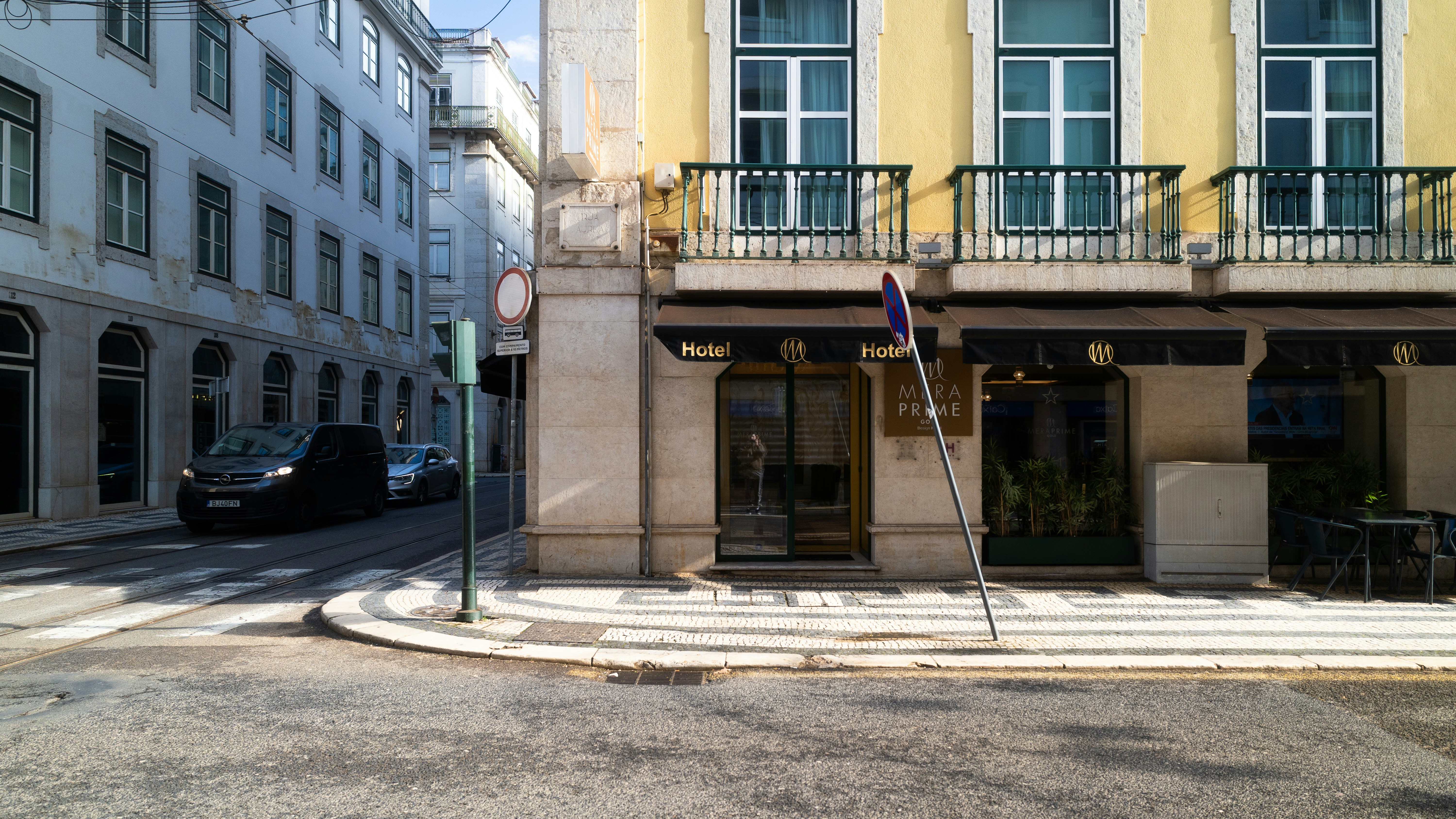 Street scene with buildings and a car