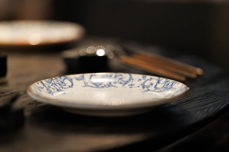 Small decorative plate with a blue floral pattern