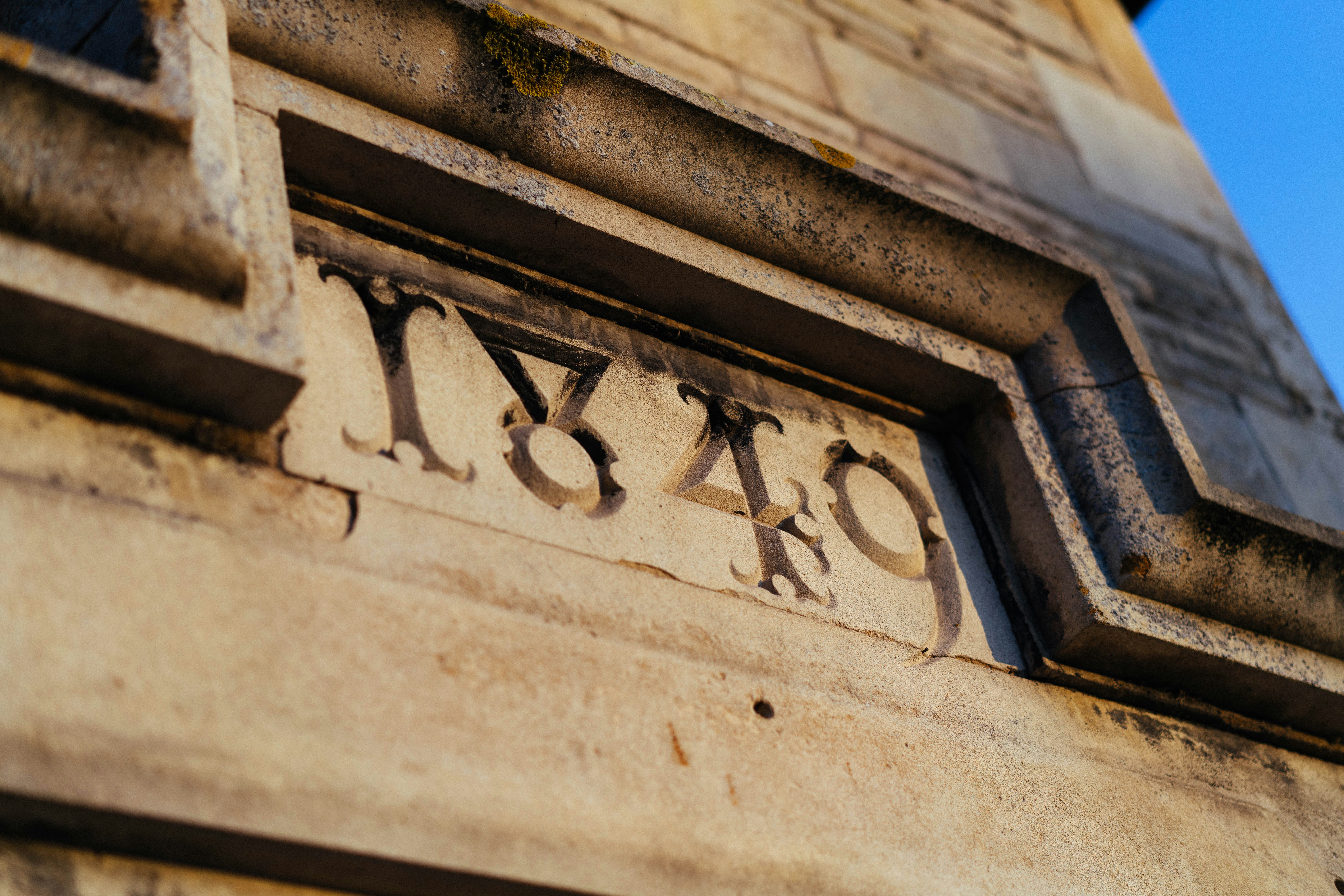 Carved year 1849 on stone building facade
