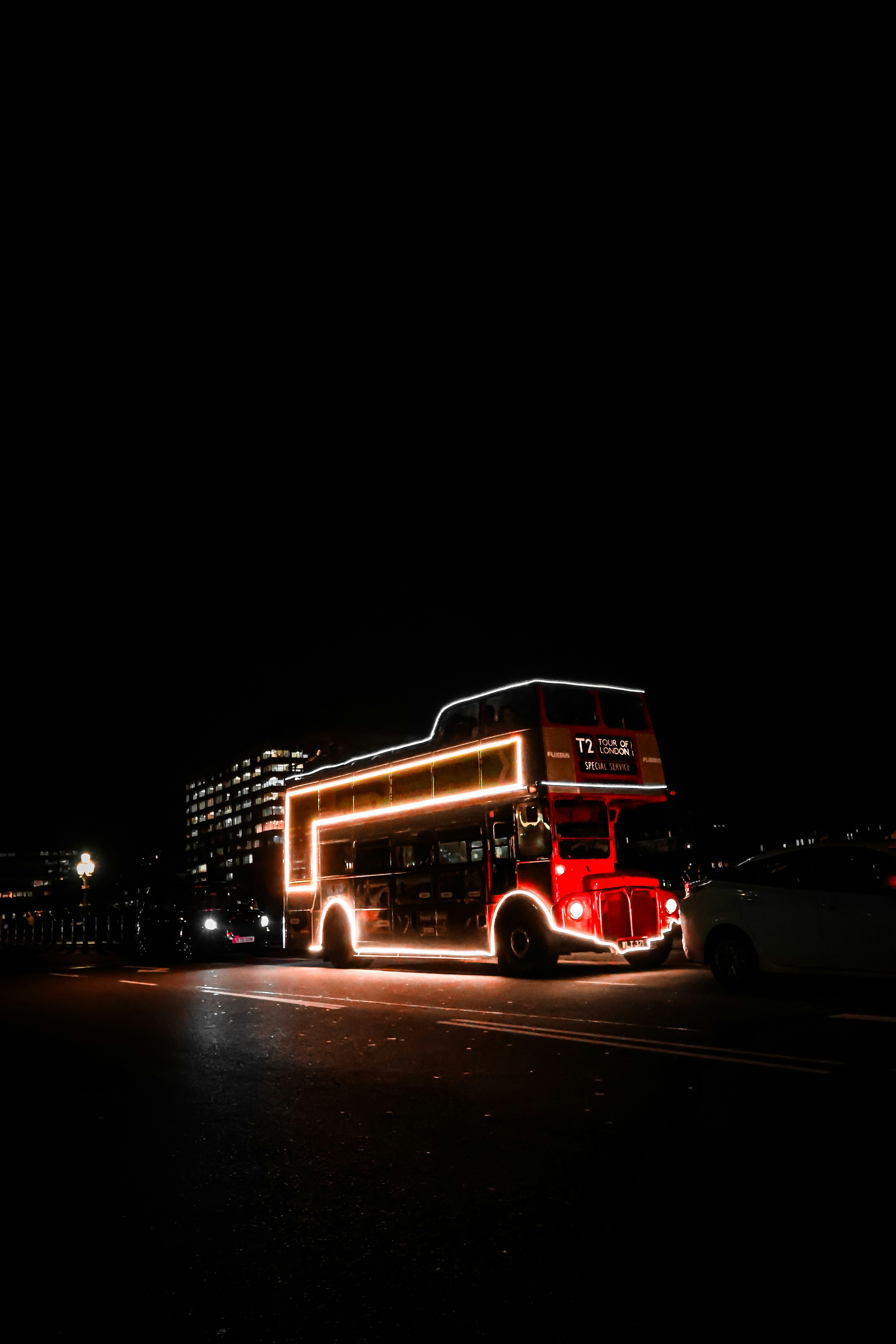 Double-decker bus decorated with lights at night. photo – Free London ...