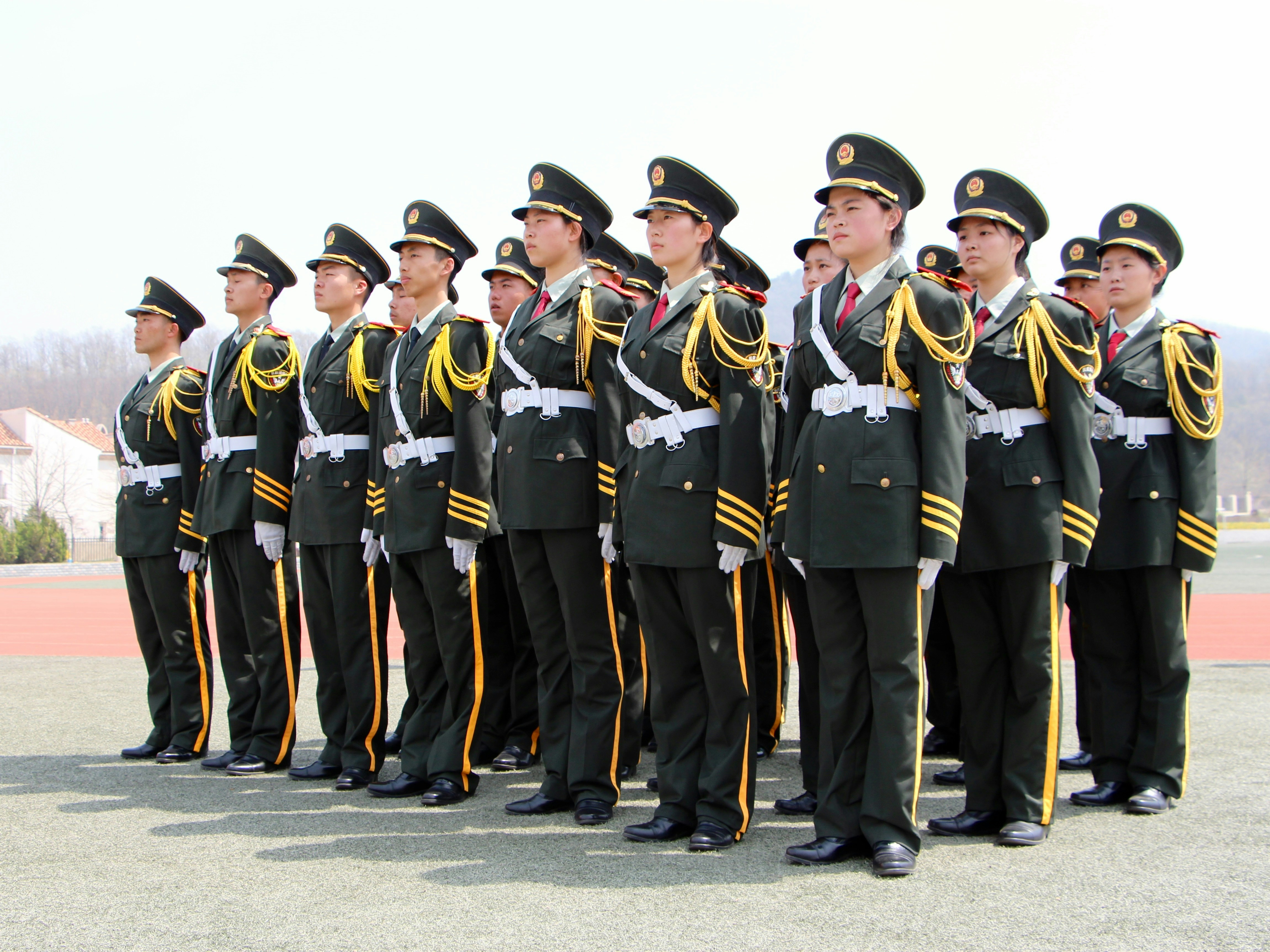 A group of soldiers in uniform standing at attention.