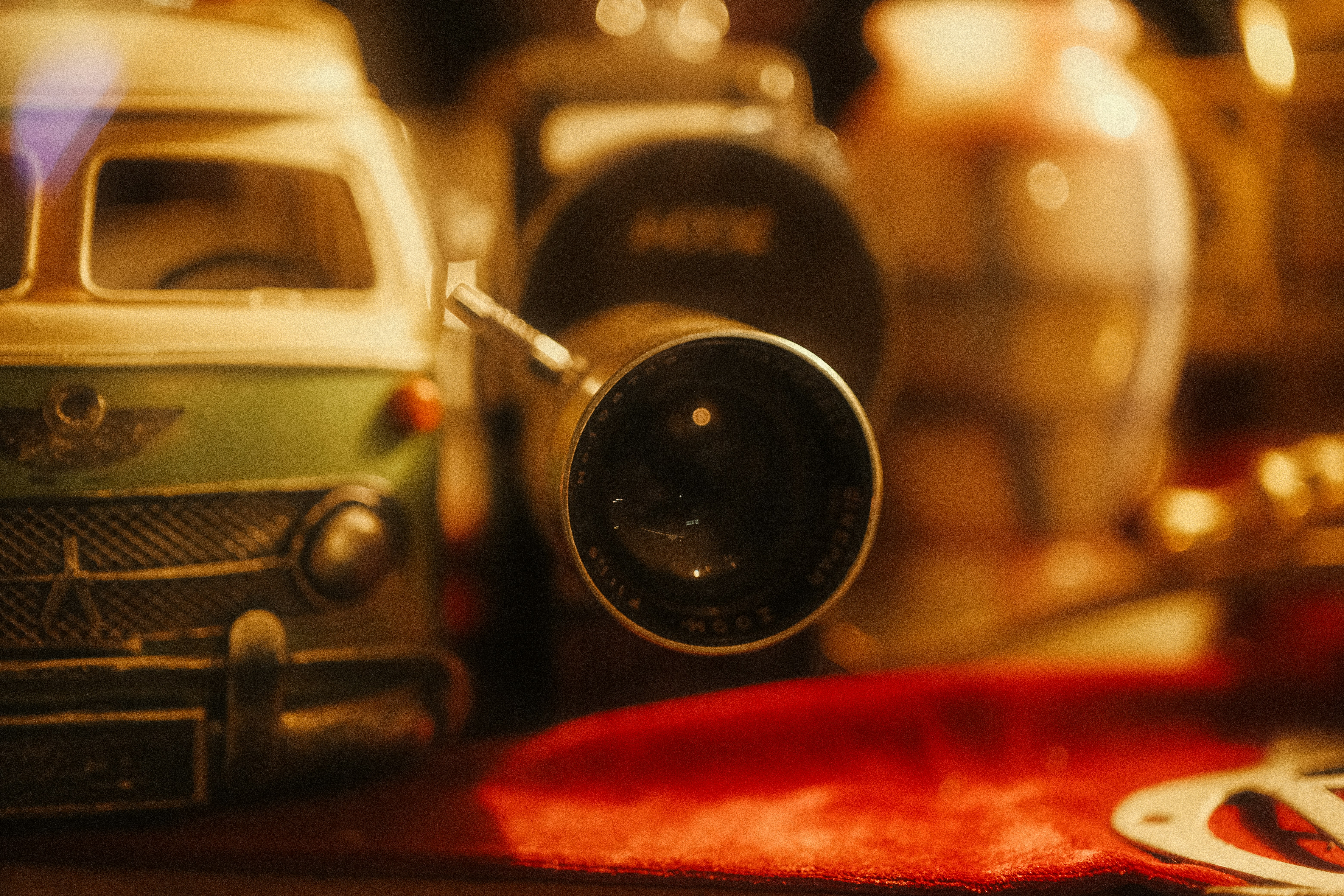 Close-up of vintage camera lens with toys