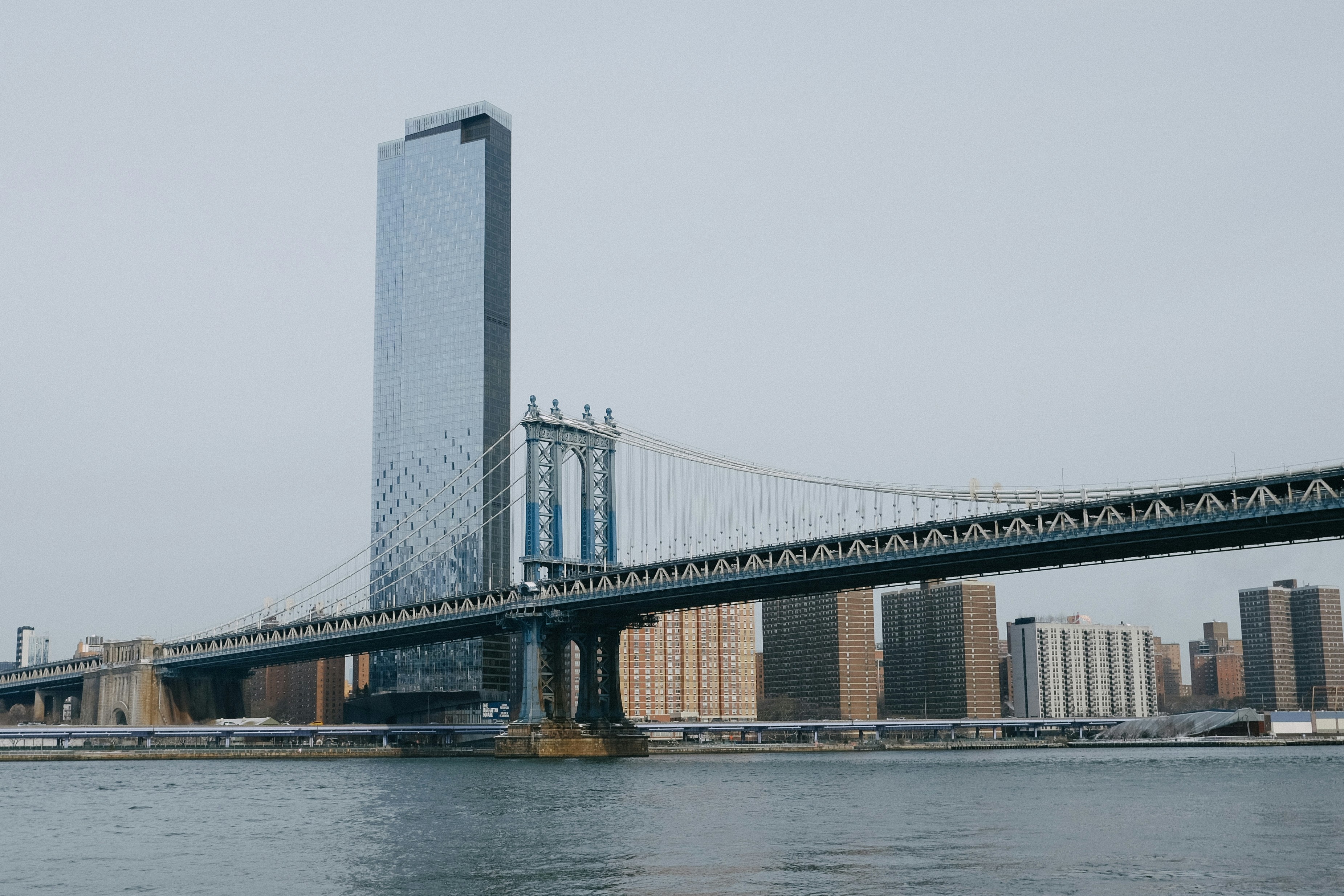 Manhattan bridge and skyscraper over water