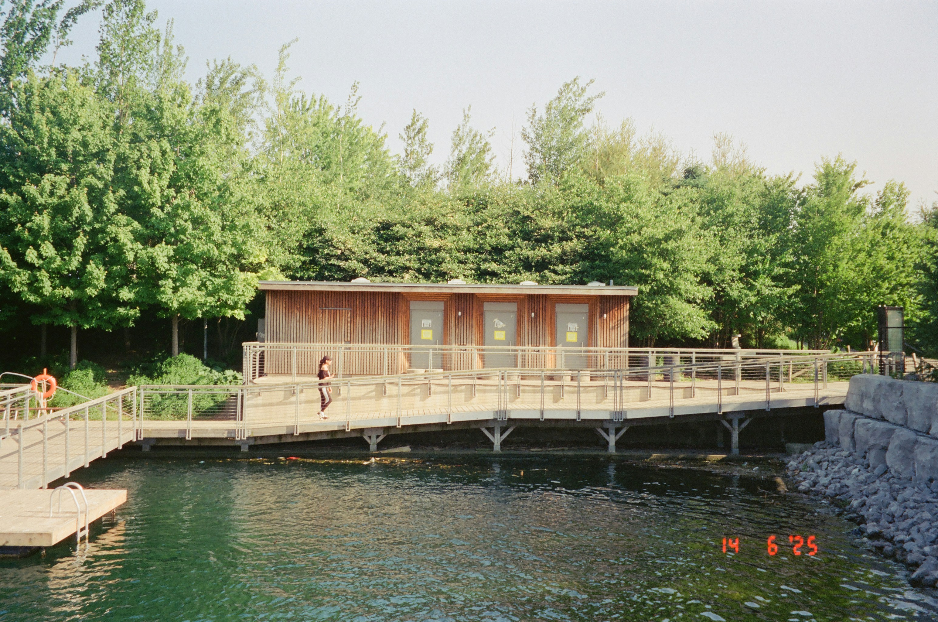Wooden building with a ramp next to water